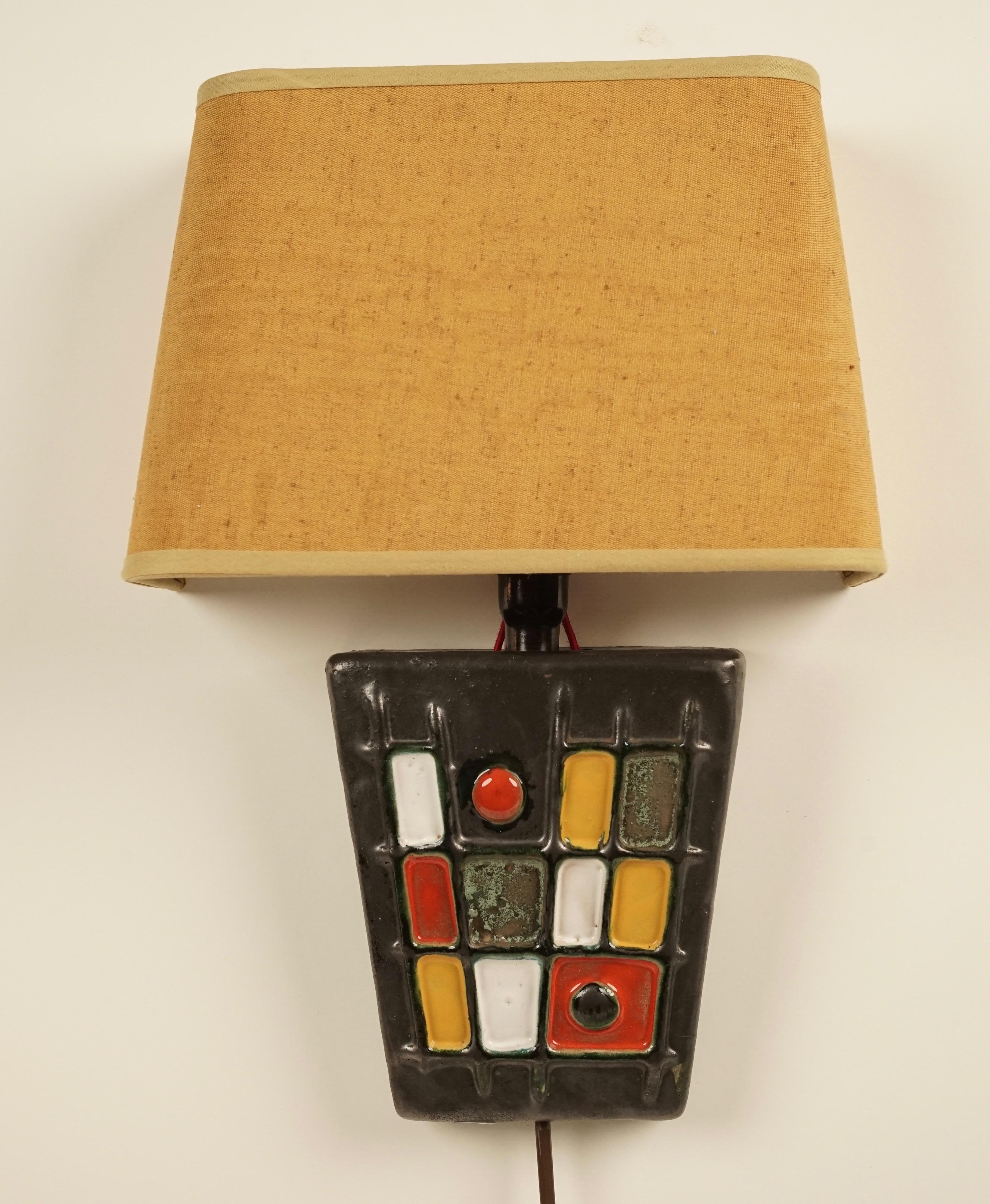 A pair of ceramic, modernist wall lights, handmade in the 1950s. These pieces were produced during the Studio Ceramic Movement in Hungary. This was a very special time in the history of contemporary ceramics in Europe. Due to language and political