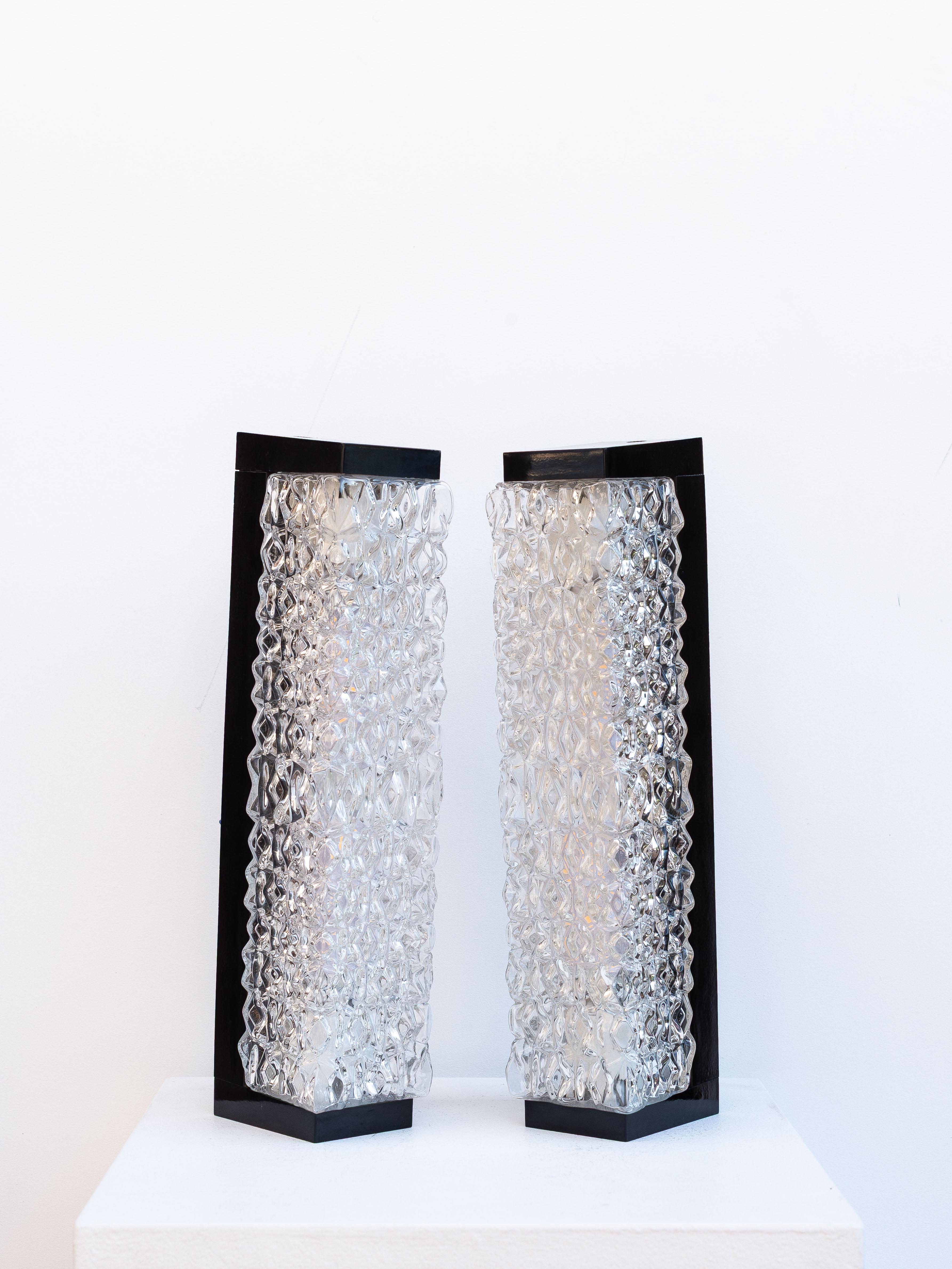 Pair of Modernist Wall Sconces in Bakelite and Glass, France 1960s

Wall sconces featuring very graphic and contemporary lines. 

Made of bakelite and frosted glass. 

Lighting: The wall sconces each take two E14 LED bulbs, which are supplied (see