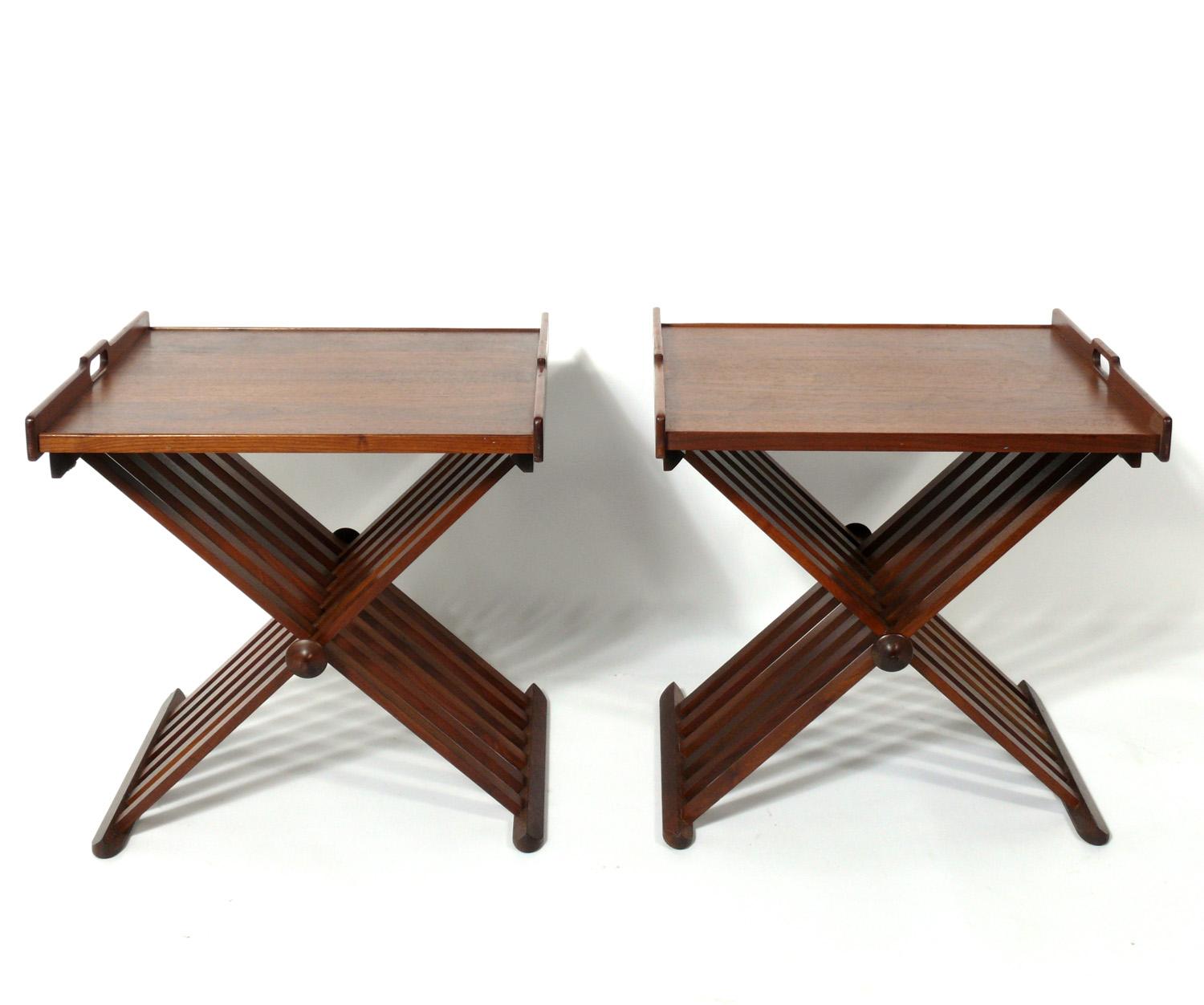 Pair of modernist walnut campaign tables, designed by Kipp Stewart and Stewart MacDougall for Drexel, American, circa 1950s. Beautiful graining to the walnut throughout. They are a versatile size and can be used as side or end tables, or as