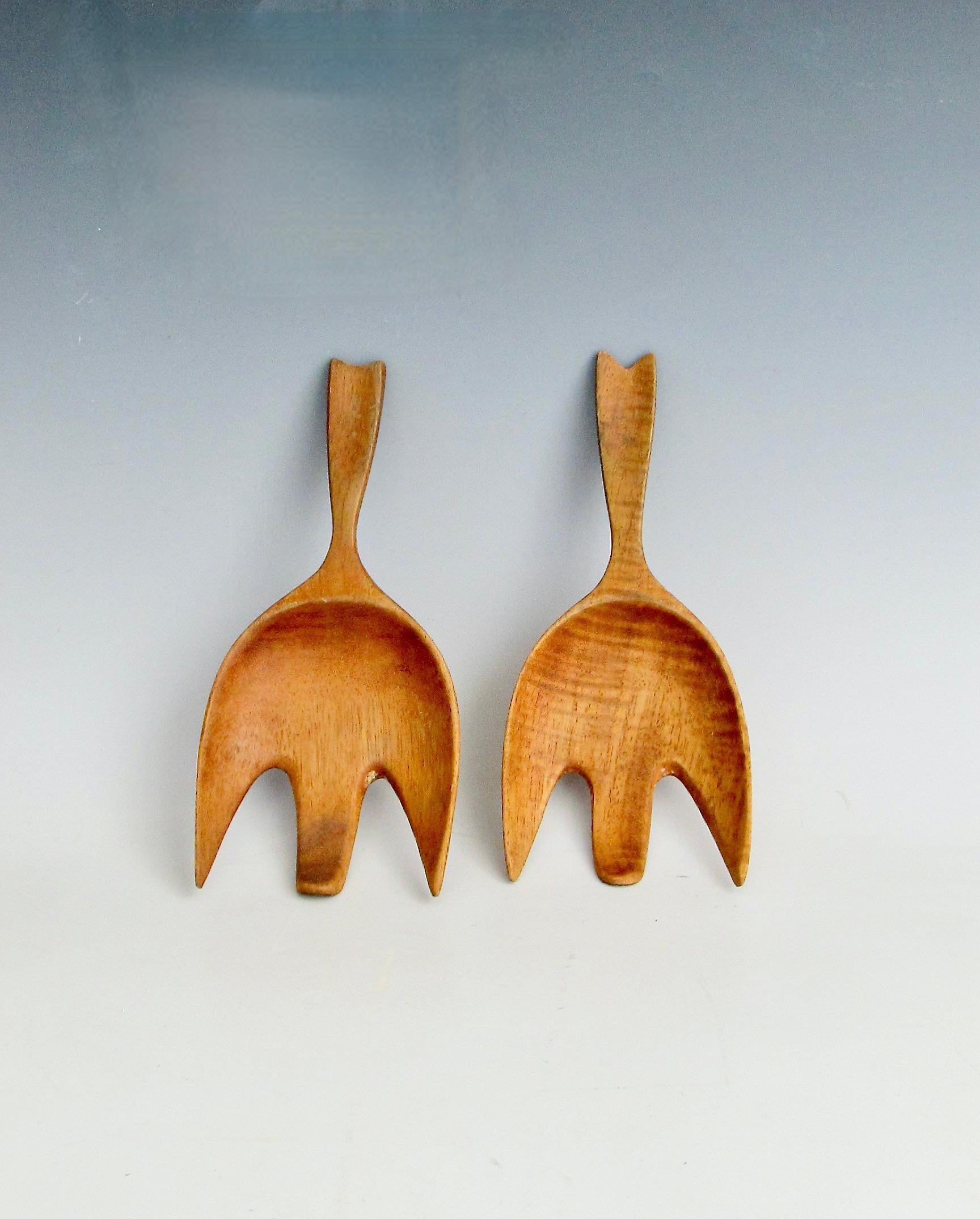 Modernist solid wood salad servers . Somewhat in the style of JHQ Dansk designs . 