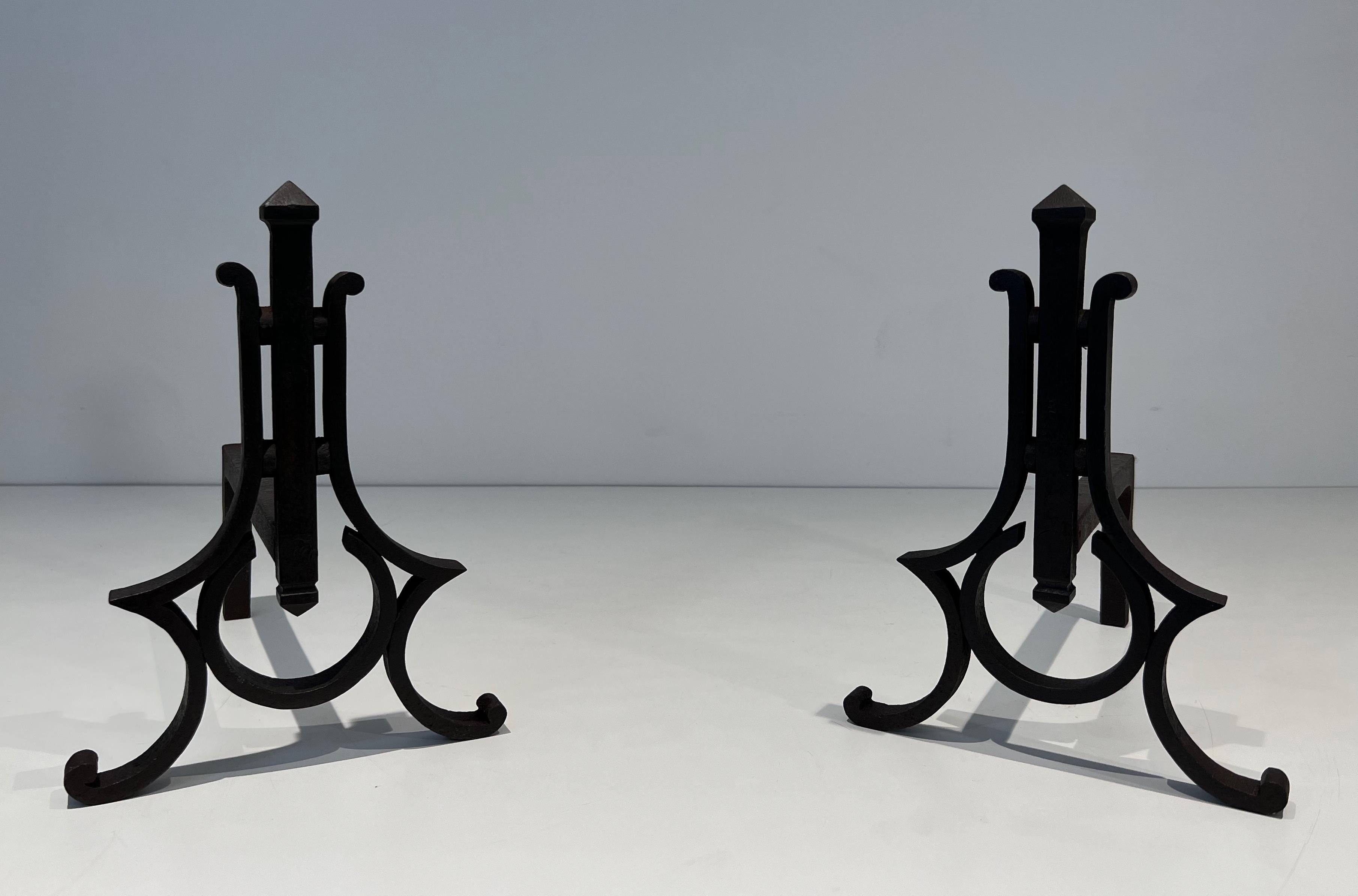 This very nice pair of modernist andirons is made of wrought iron. This is a French work. Circa 1940