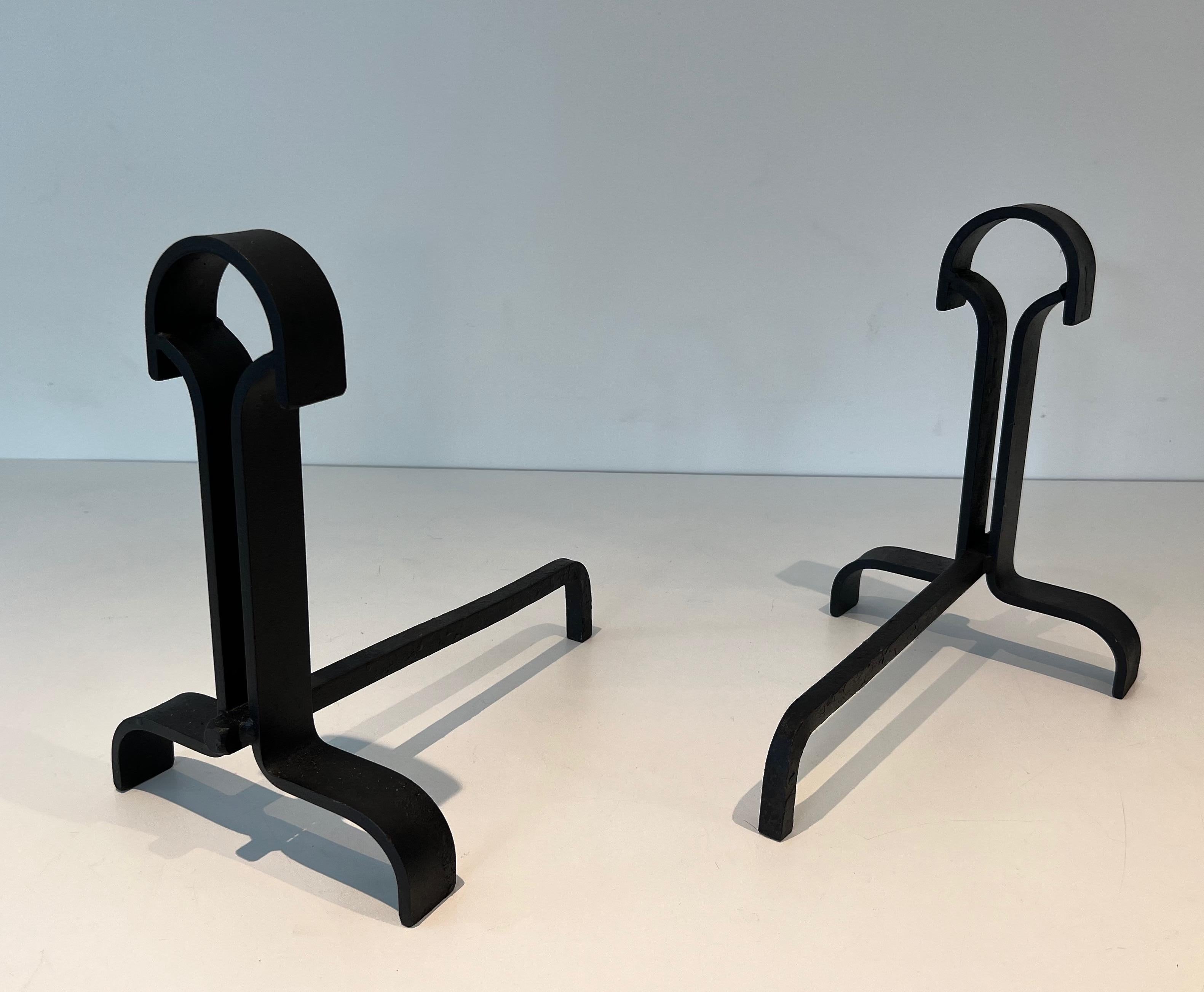 Wrought Iron Pair of modernist wrought iron andirons. French work. Circa 1940 For Sale