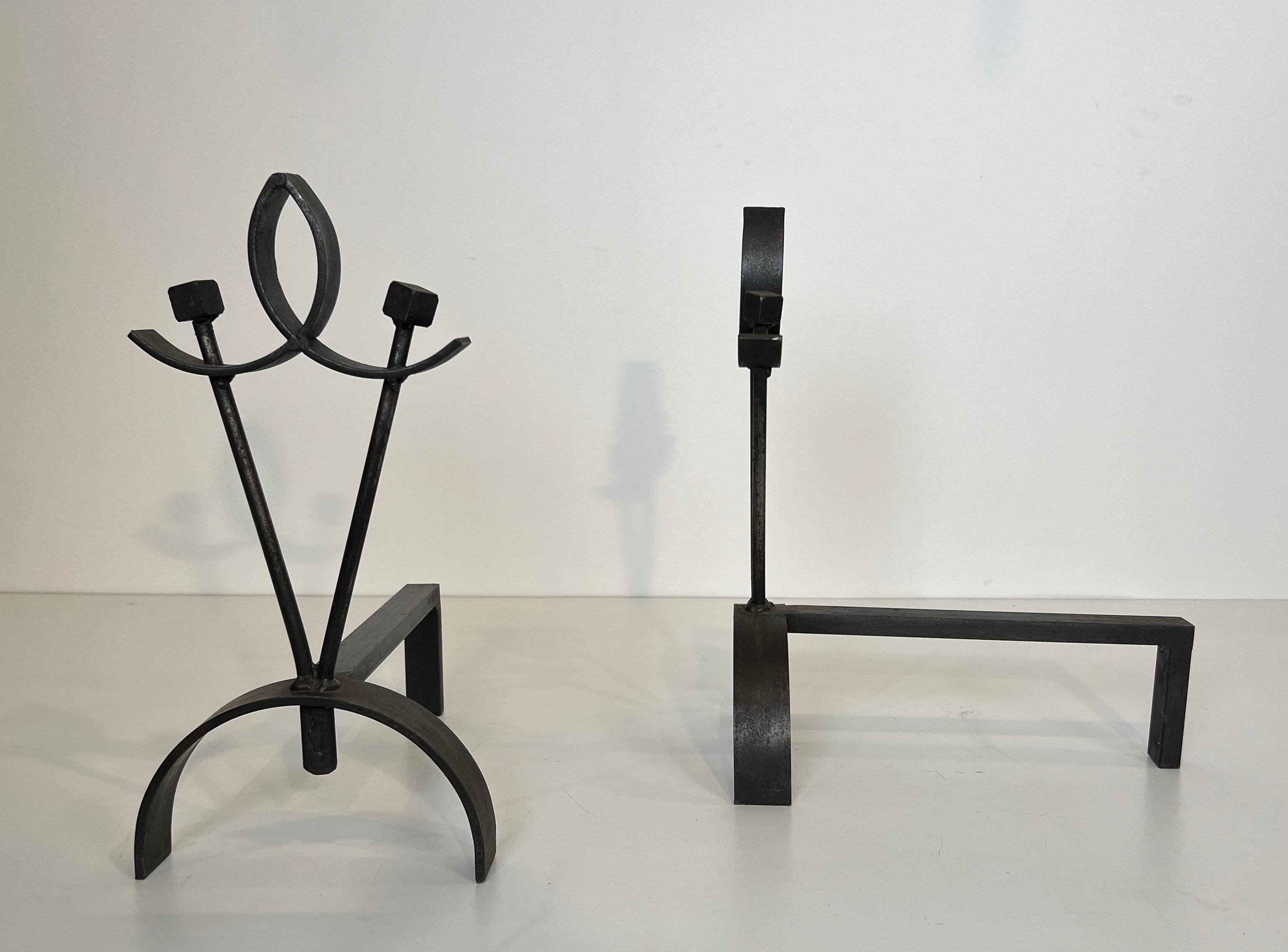 Wrought Iron Pair of modernist wrought iron andirons. French work. Circa 1940 For Sale