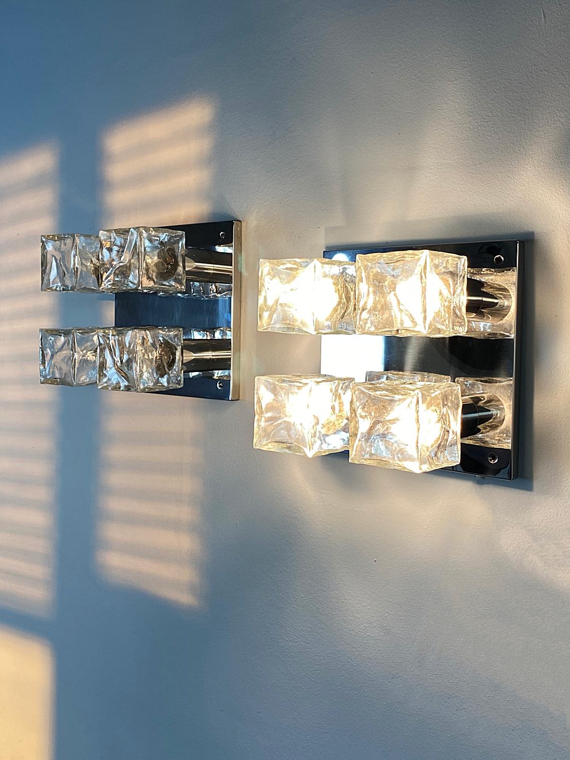 Pair of beautiful modernist fixture lights manufactured by J.T. Kalmar in 1960s, Vienna. The lights can be used as wall or ceiling lamps. They are featuring a polished stainless steel body with ice glass cubes.
Fully working and tested condition.