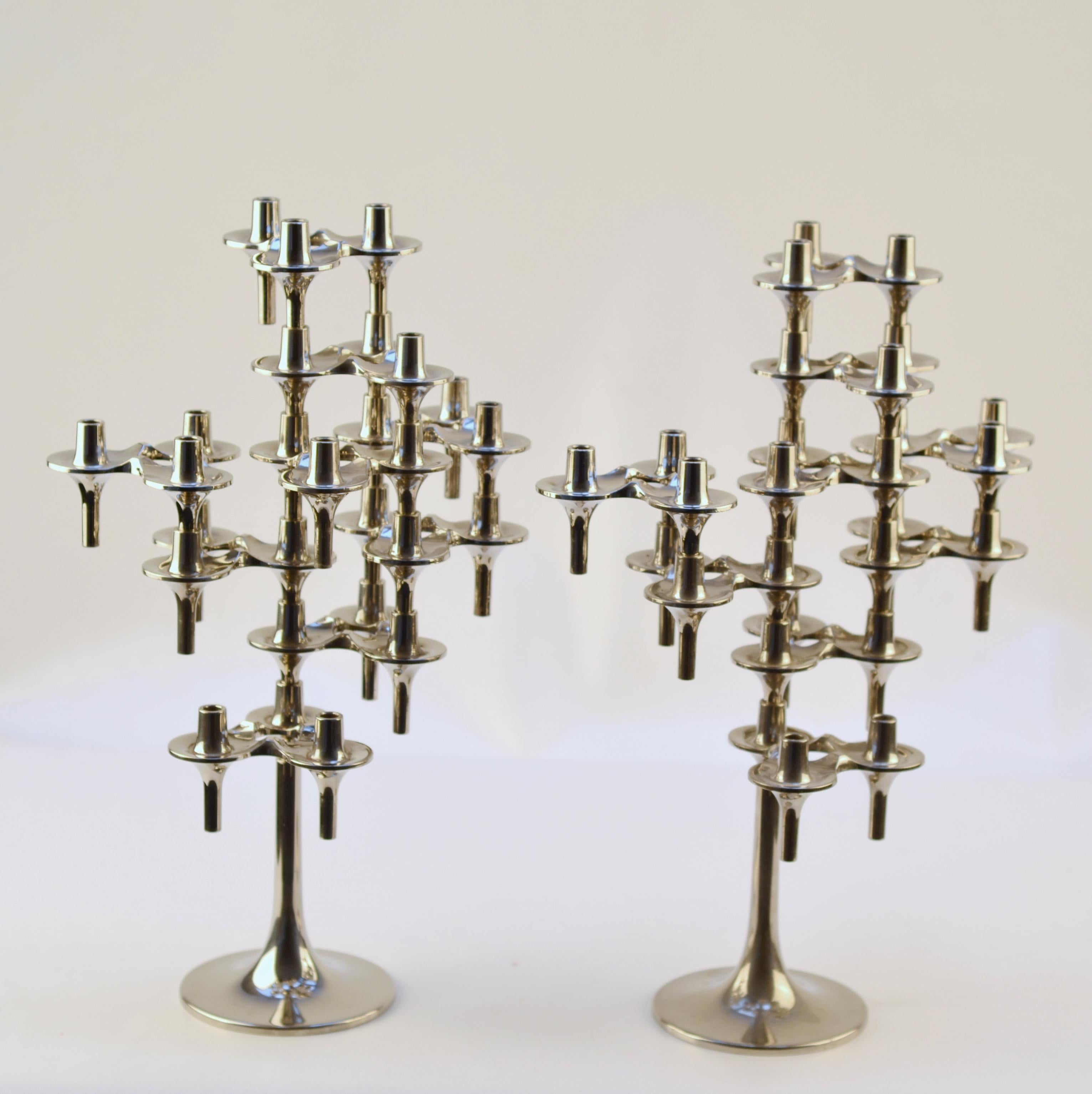 Set of two chromed candelabras stands with each 9 modular pieces. Orion Mid-Century Modern candle holders were designed by Fritz Nagel & Ceasar Stoffi, 1960. Orion candle holders were at manufactured by BMF (Bayerische Metallwaren Fabrik) Nagel in