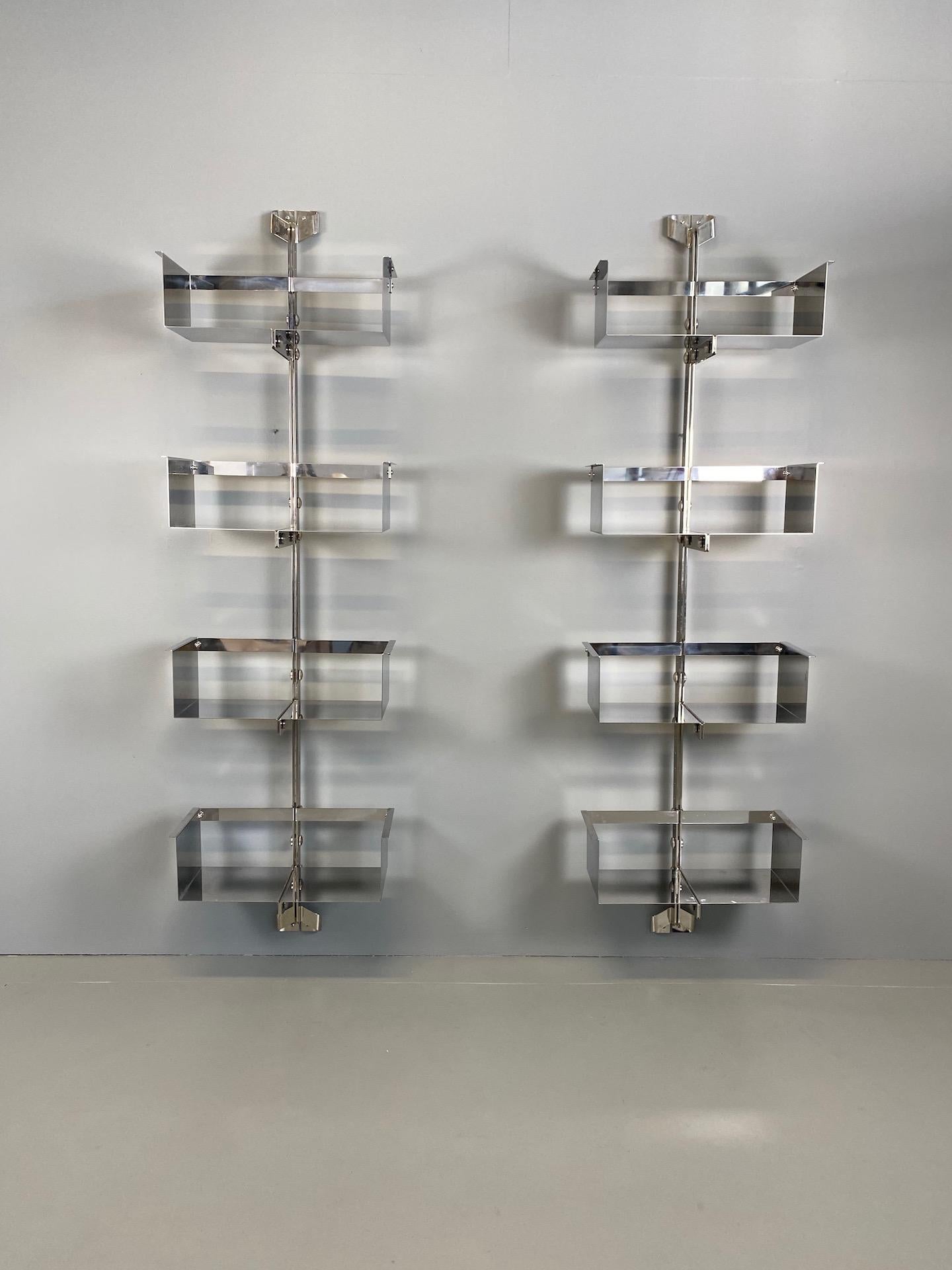 Pair of modular wall-mounted shelving system designed by Vittorio Introini, produced by Saporiti, Italy, circa 1969. Whit original label. Stainless steel, very good condition. Shelves can be used individually or combined together in many different