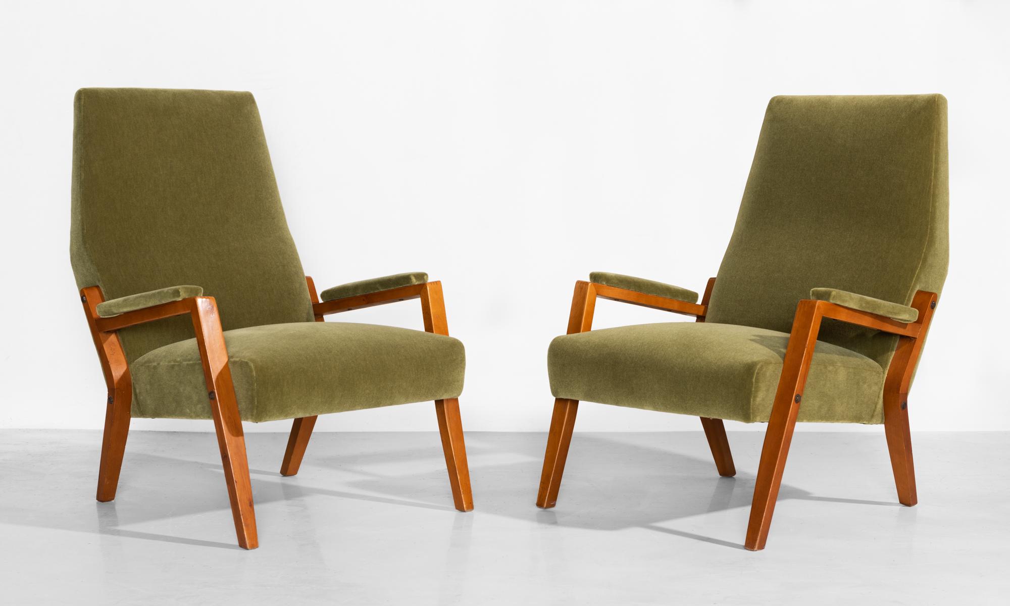 Pair of mohair lounge chairs, Italy, circa 1960

Handsome, low forms with beautiful joinery details, metal hardware and newly upholstered seats and armrests in Maharam mohair supreme.