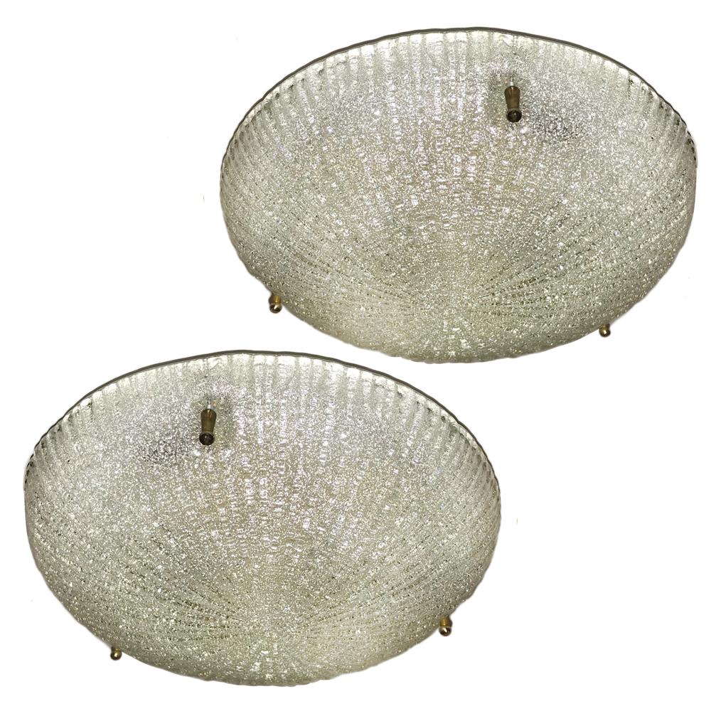 Pair of circa 1960s Swedish molded glass flush-mounted light fixtures. Sold individually.

Measurements:
Diameter 10