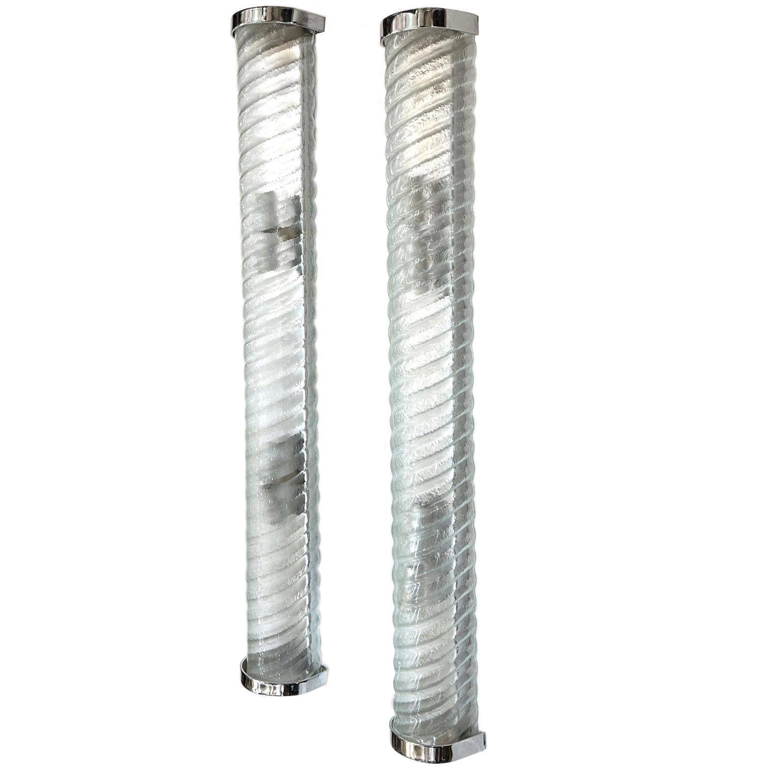 Pair of large Italian 1960's molded glass sconces with interior lights.

Measurements:
Height: 32