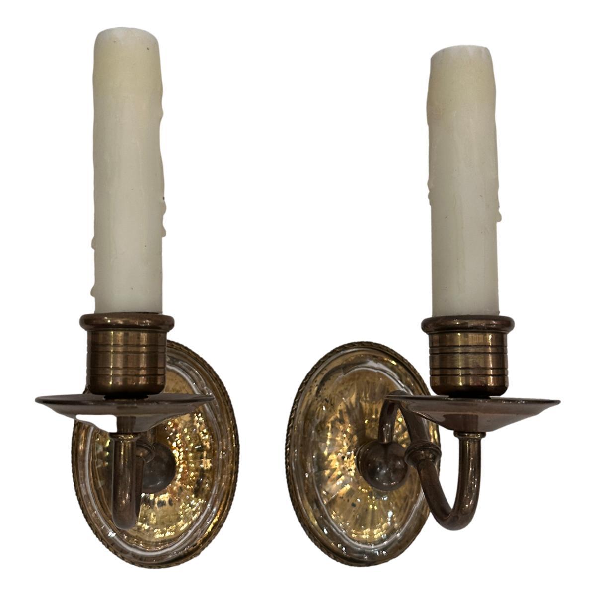 Pair of 1920's English sconces with molded glass body.

Measurements:
Height: 9