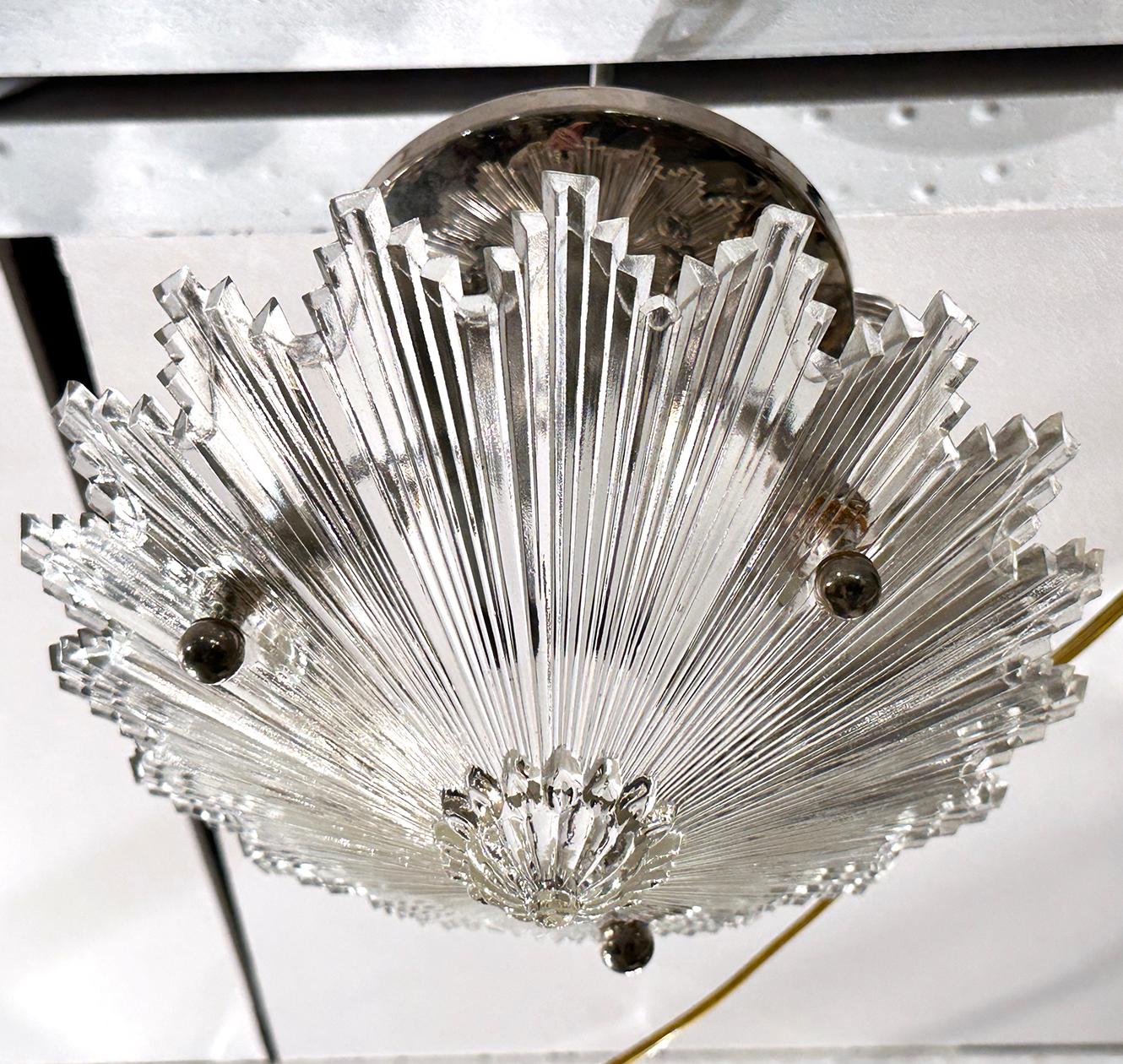 Pair of French circa 1940's molded glass light fixtures. Sold Individually

Measurements:
Drop: 7