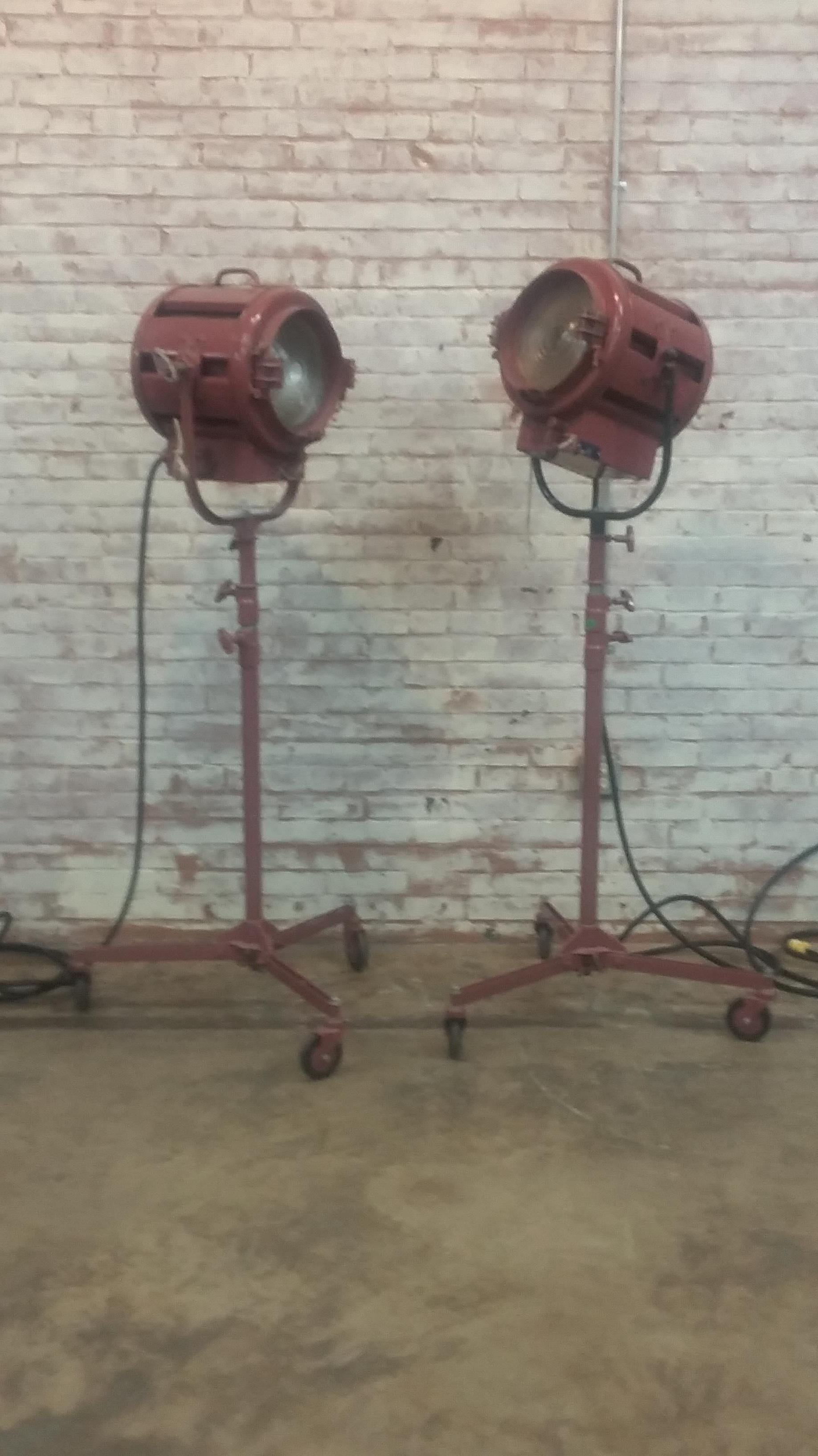 Great pair of vintage spotlights. Signed Mole-Richardson Co. Hollywood, Ca. Each light works (see photos) and rests upon a tripod base. Marked as type 412 junior solarspot. Each light also complete with folding metal attachment (shield).

 
