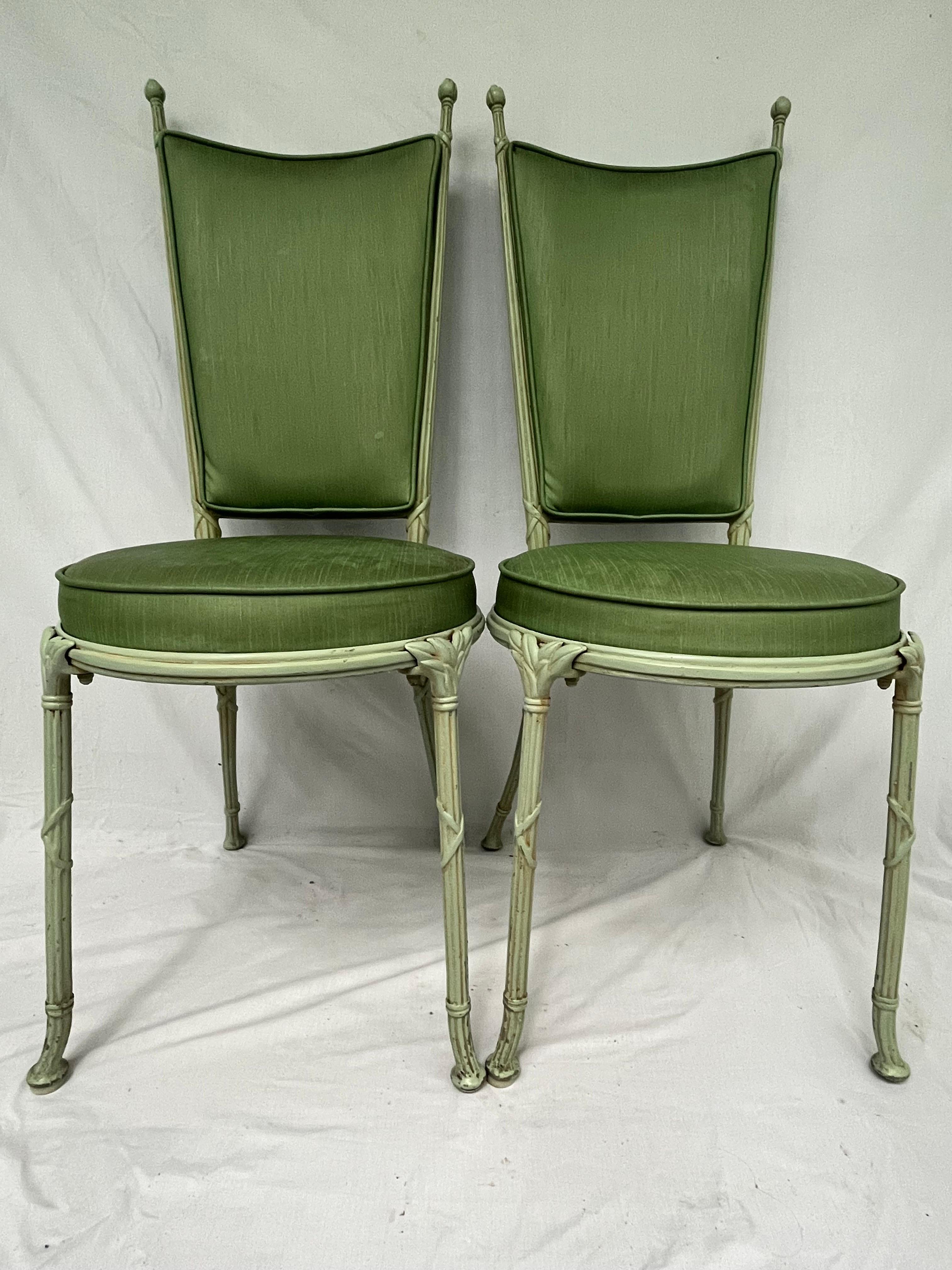 A gorgeous and timeless pair of mid 20th Century garden or patio chairs designed and cast by the English firm Molla. These chairs are cast in an aluminum and magnesium mixture. The Molla company was among the first (and best if you ask me) to create