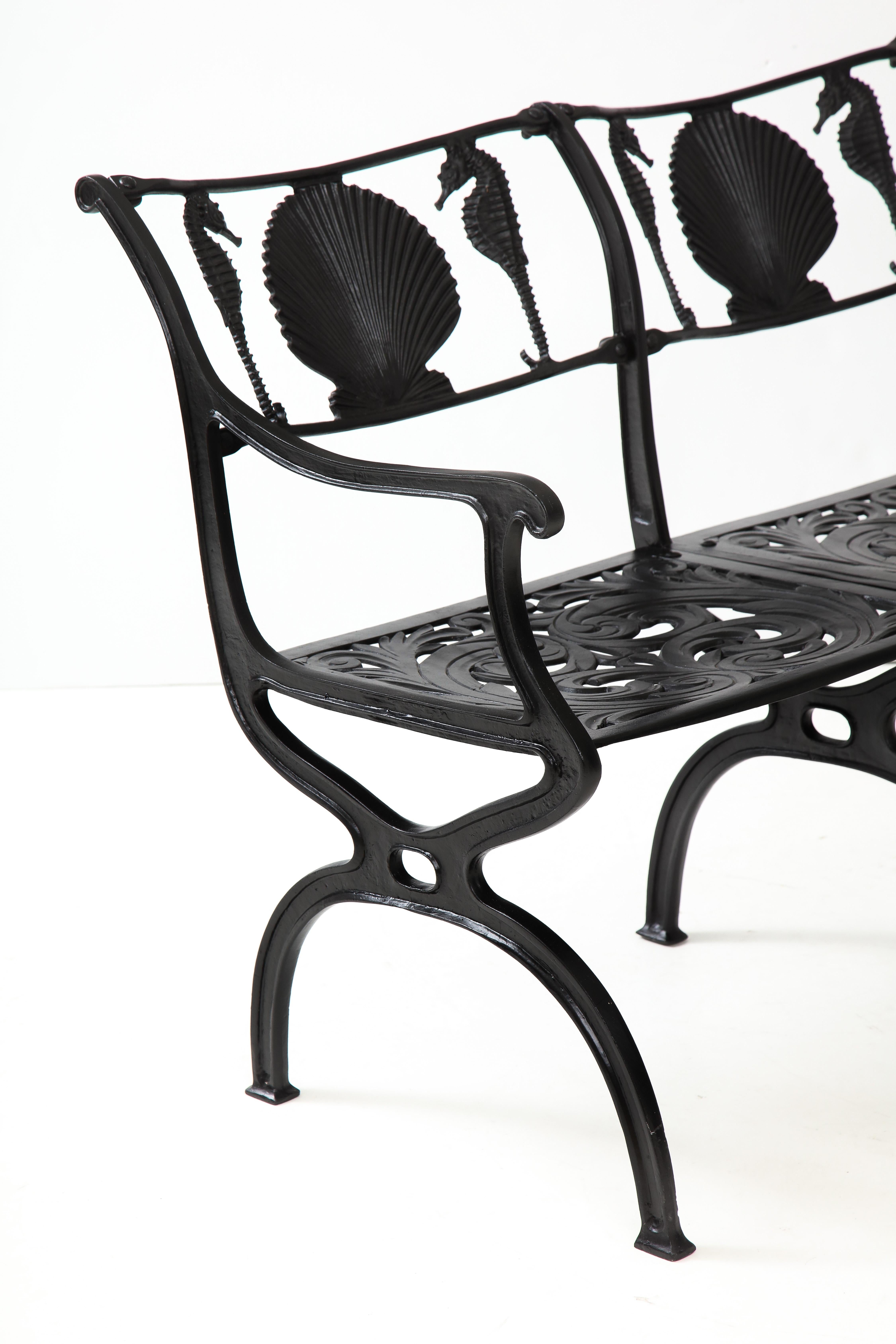 Pair of Molla shell and seahorse motif backrest cast aluminium benches.