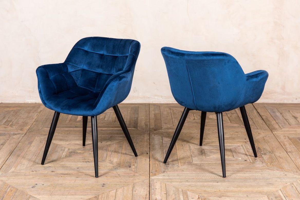 A fine pair of Monet velvet dining chairs, 20th century. 

Add an instant style update to your dining room with the Monet velvet dining chairs. With black metal Minimalist legs and luxurious velvet upholstery to the seat, which features subtle