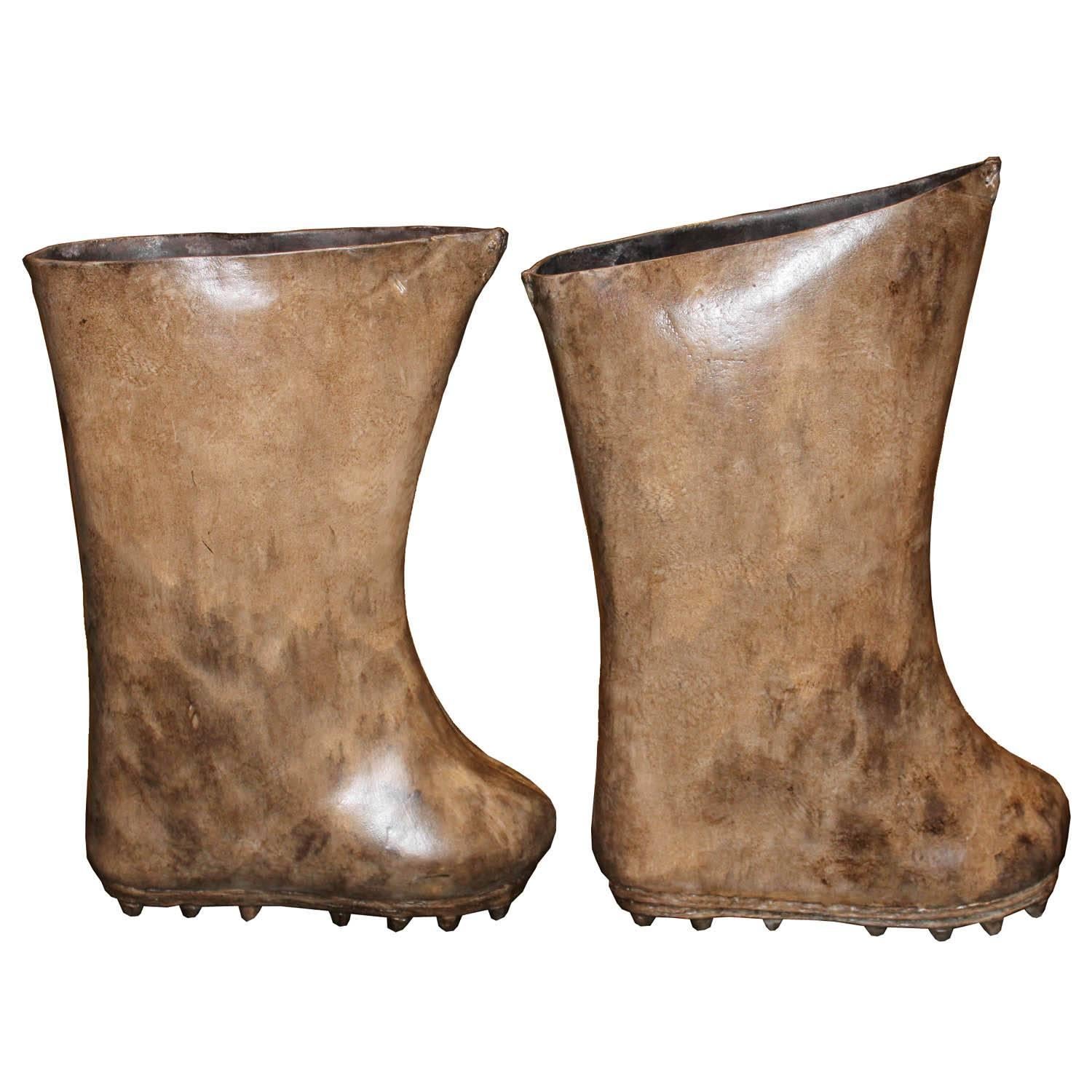 Leather boots with spikes were used for walking on ice. Unusual accessory for a coffee or console table. Mongolia.