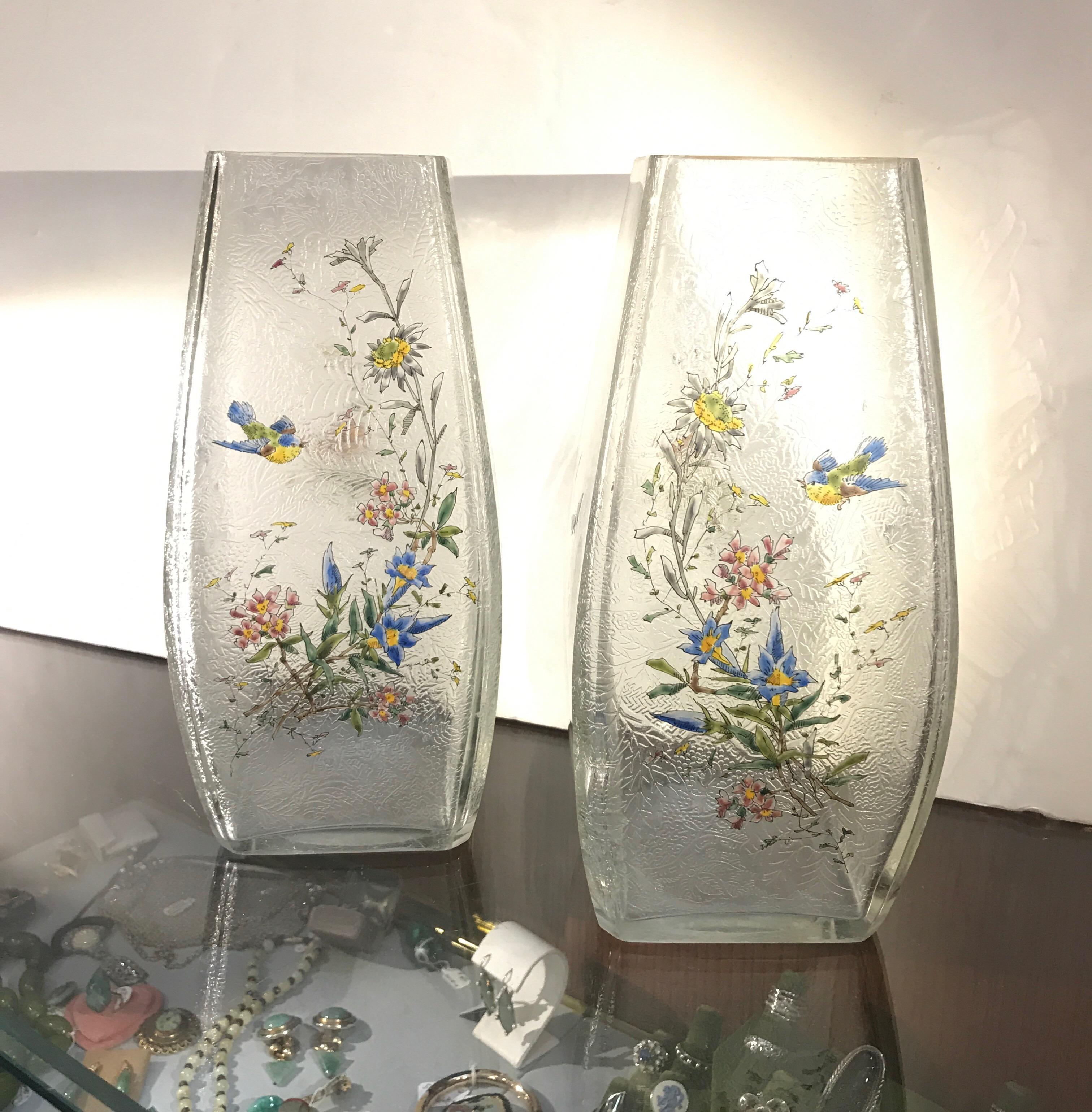 A fine pair of Mont Joye, French acid etched glass and enameled rectangular tapered vases.
The interior is acid etched design, with the exterior hand enameled with birds, floral branches and butterflies mainly on the fronts, small sprigs on the