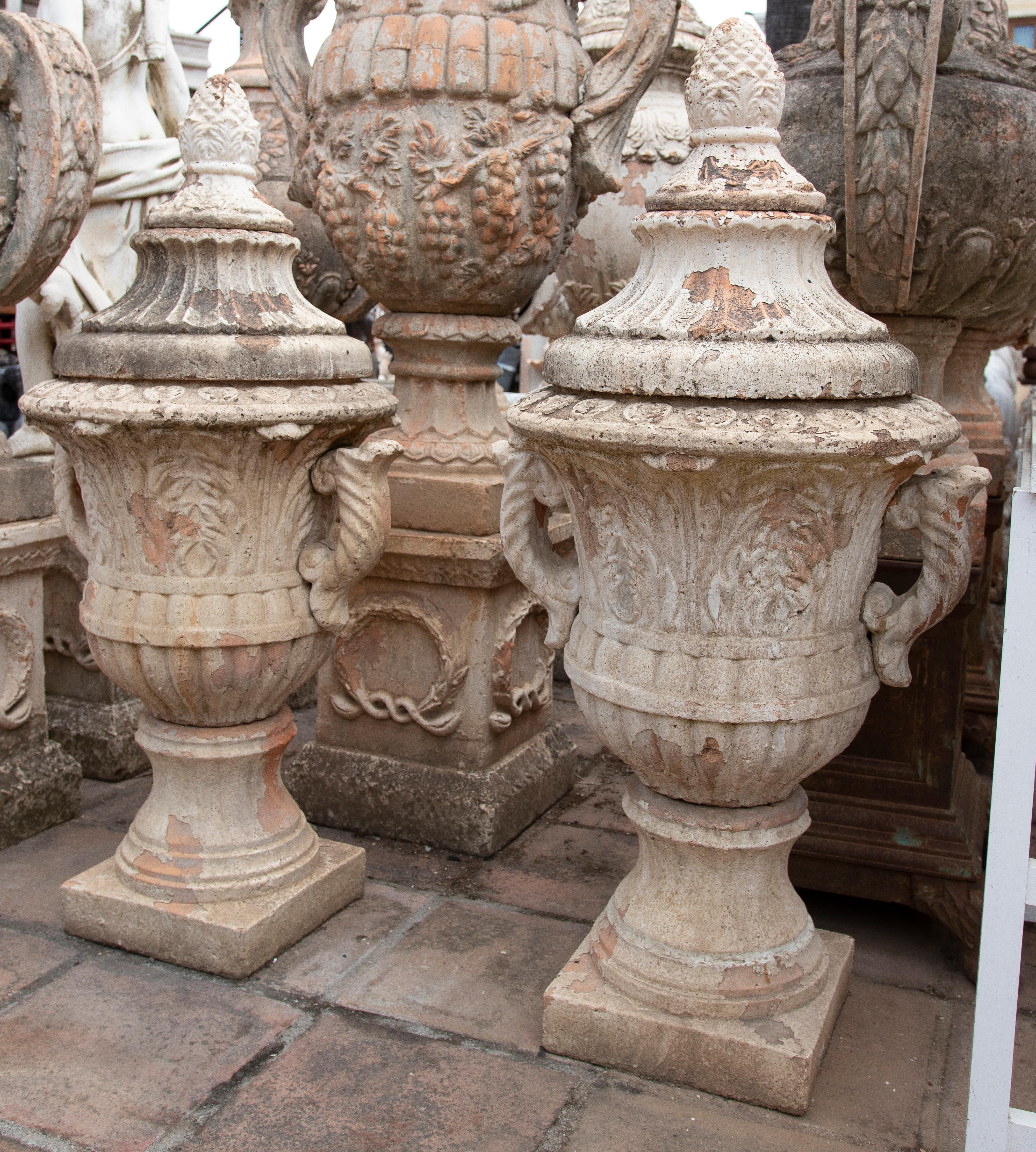 Pair of monumental classical 1990s French natural terracotta garden urn planters with lids.