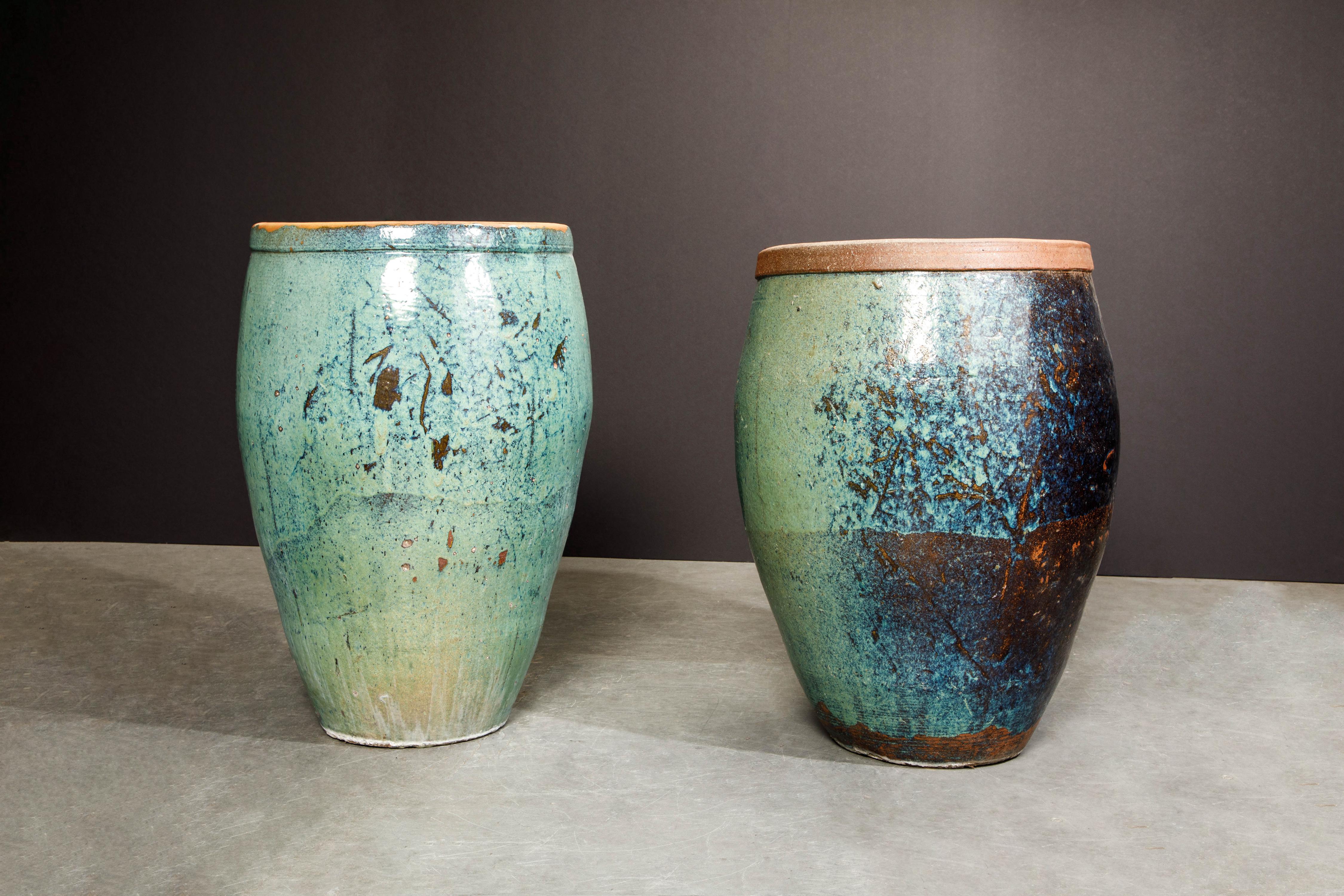 This pair of beautiful glazed ceramic pots were acquired from a Beverly Hills estate. The owner of the home stated he did not know when the pots were made but that he moved into the home in the early 2000's and that they were there when he moved in.