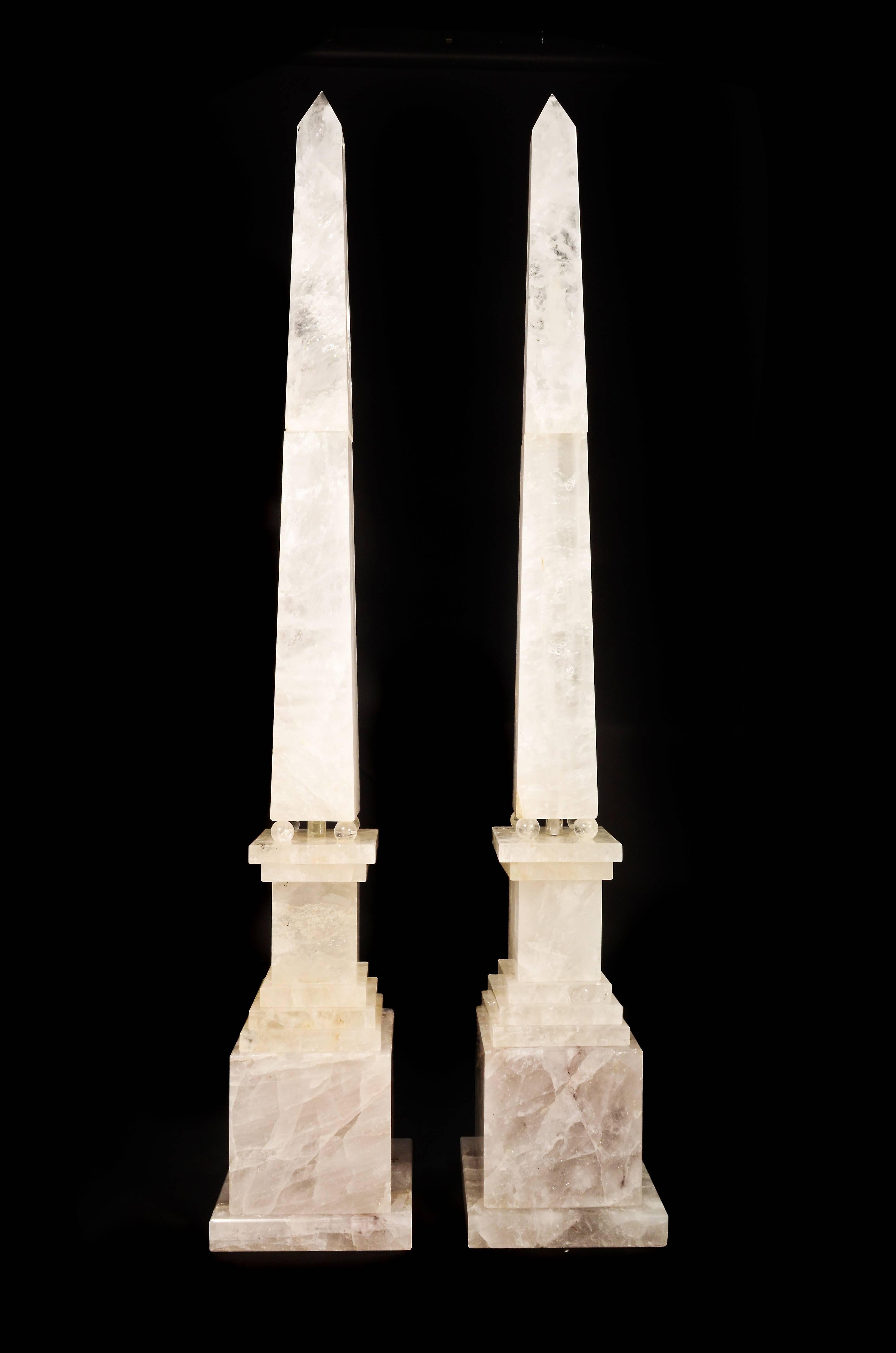 A pair of monumental, large and highly important Art Deco style cut rock crystal obelisks of are size and proportion.