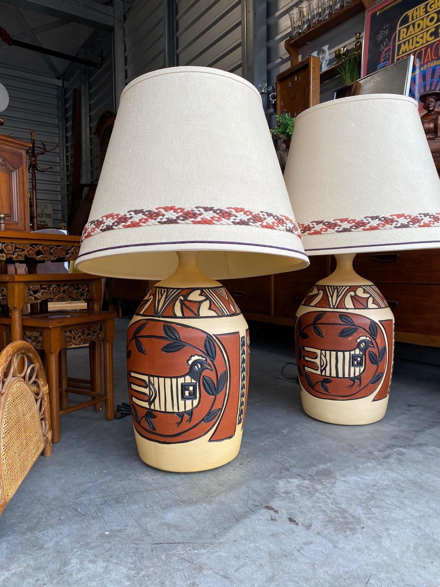 Gorgeous large painted lamps from the 1960's- 1970's. Painted in a Southwestern or Aztec Style. Simply gorgeous in person.
 