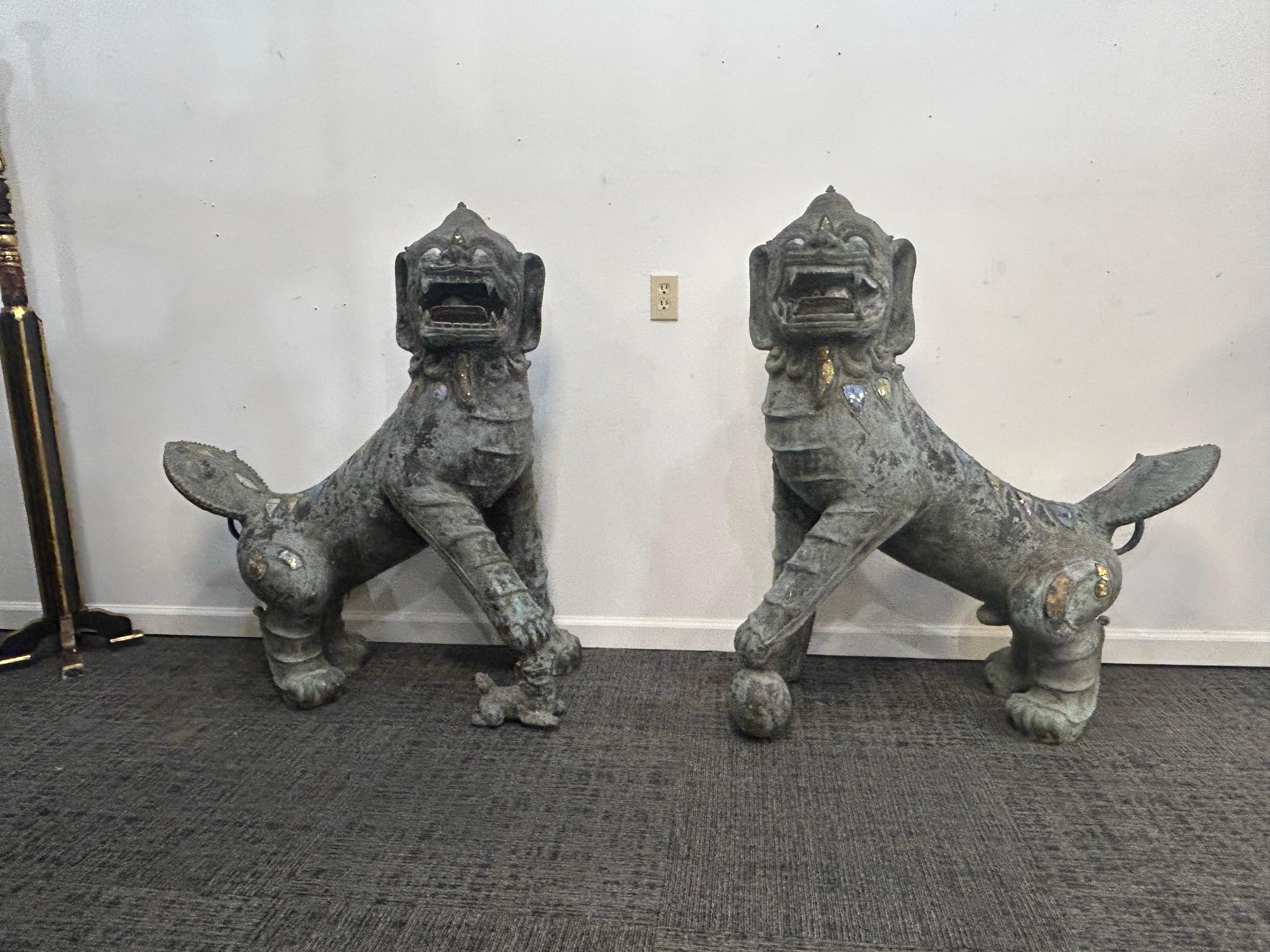Chinoiserie Pair of monumental bronze Foo Dogs For Sale