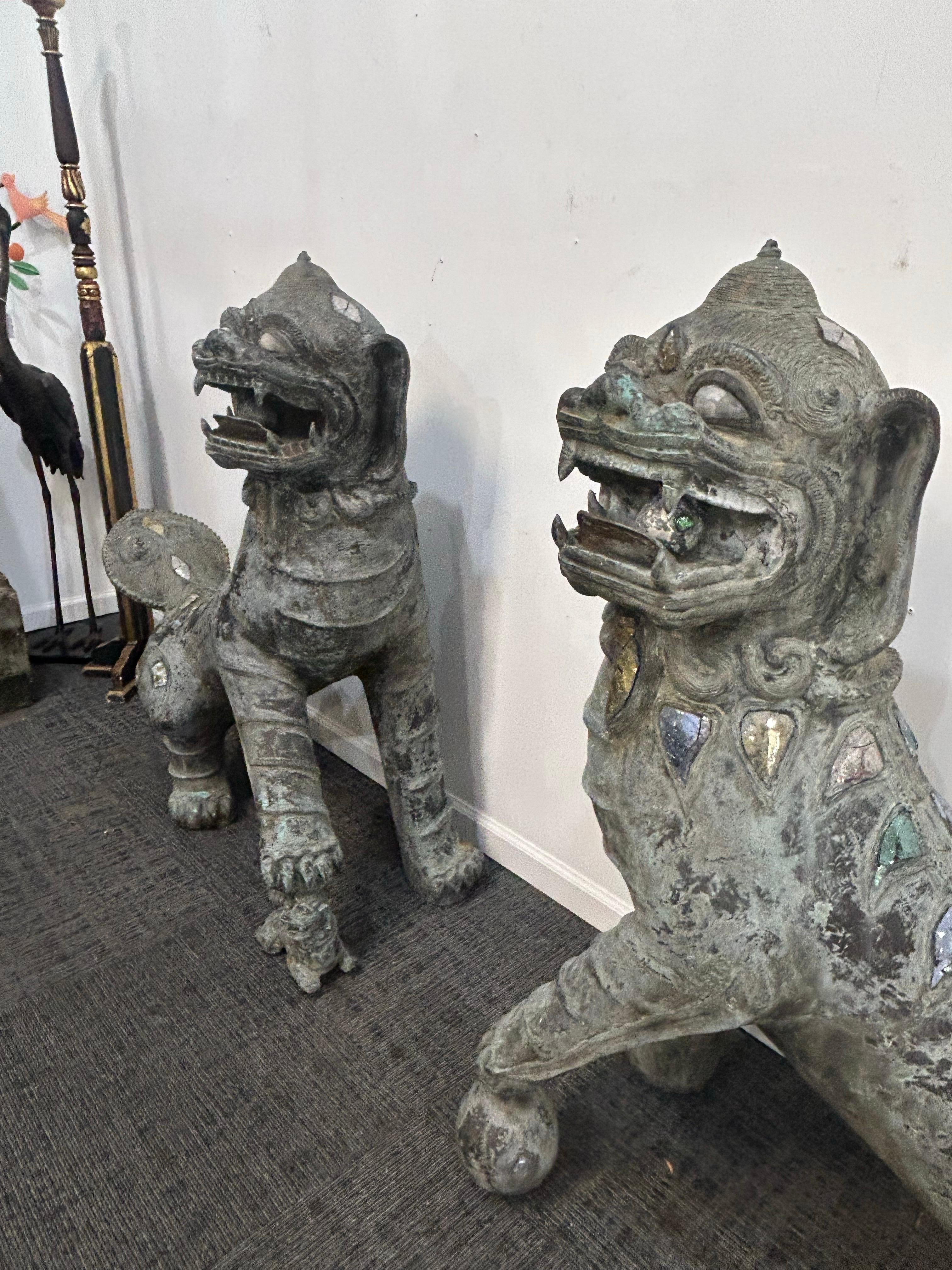 Cast Pair of monumental bronze Foo Dogs For Sale