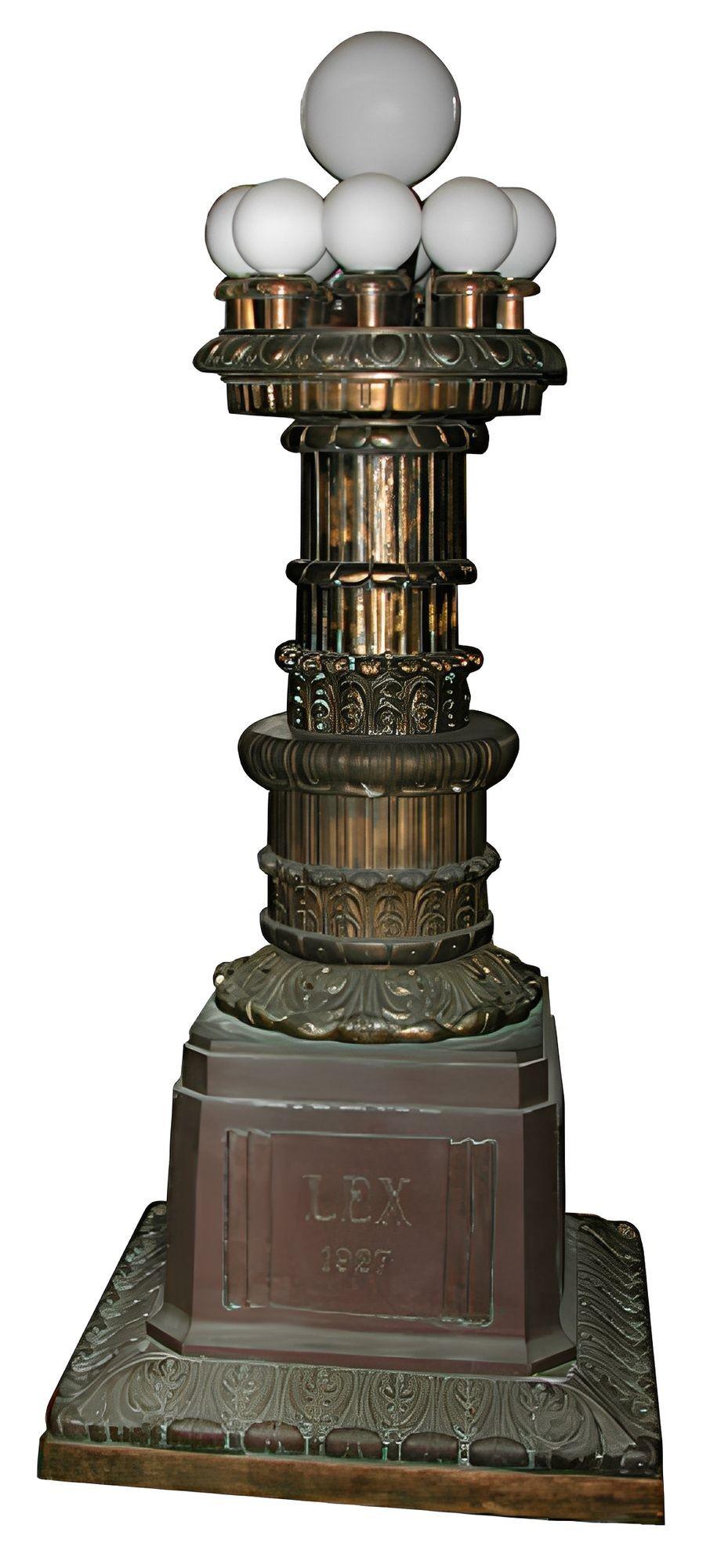 A striking pair of monumental Art Deco torcheres, salvaged from a historic Chicago courthouse and inscribed “LEX”(Latin for Law) and “1927”. These architectural torchieres embody the grandeur and optimism of early 20th-century civic design — where
