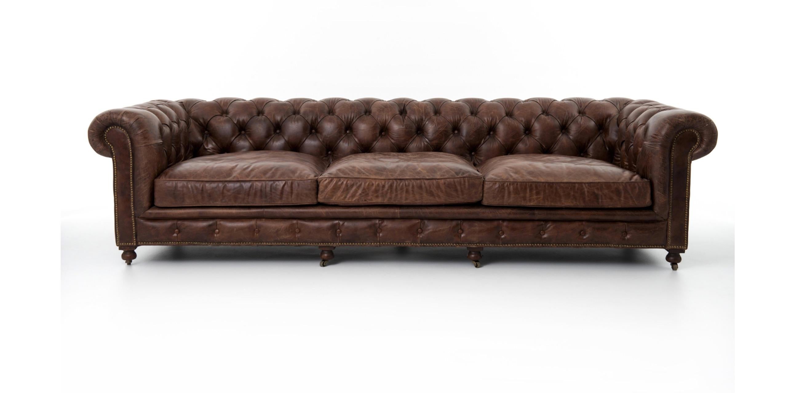 20th Century Pair of Monumental Distressed Leather Chesterfield Sofas. Priced Per Sofa.