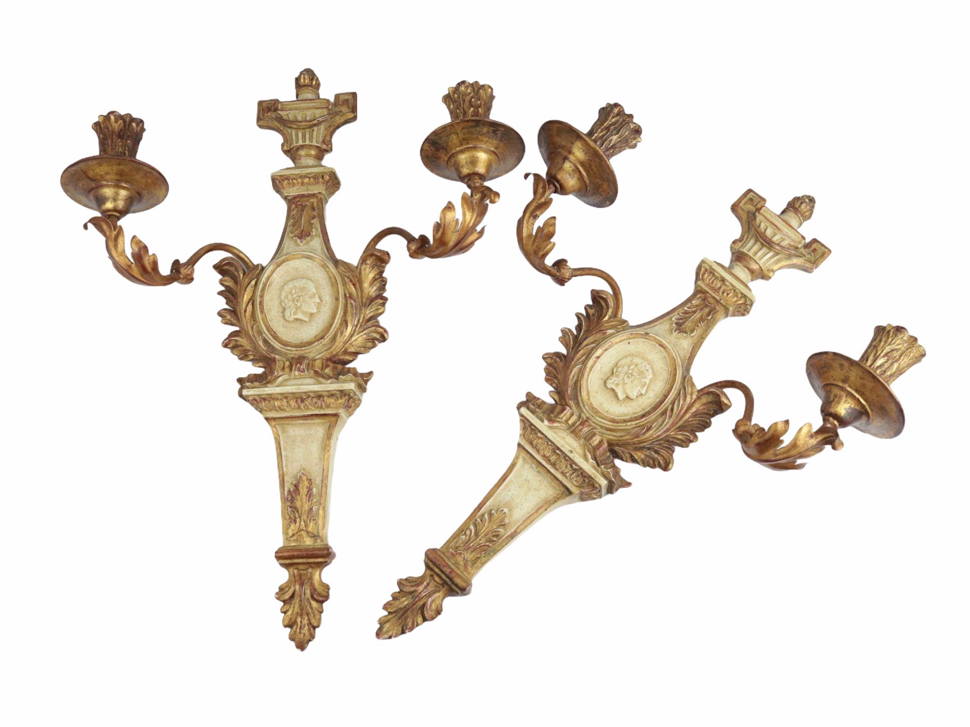 Pair of giltwood candlestick wall sconces 1970s in empire style. Each fixture requires two candles. The wall lights have a beautiful patina and gives each room an eclectic statement.