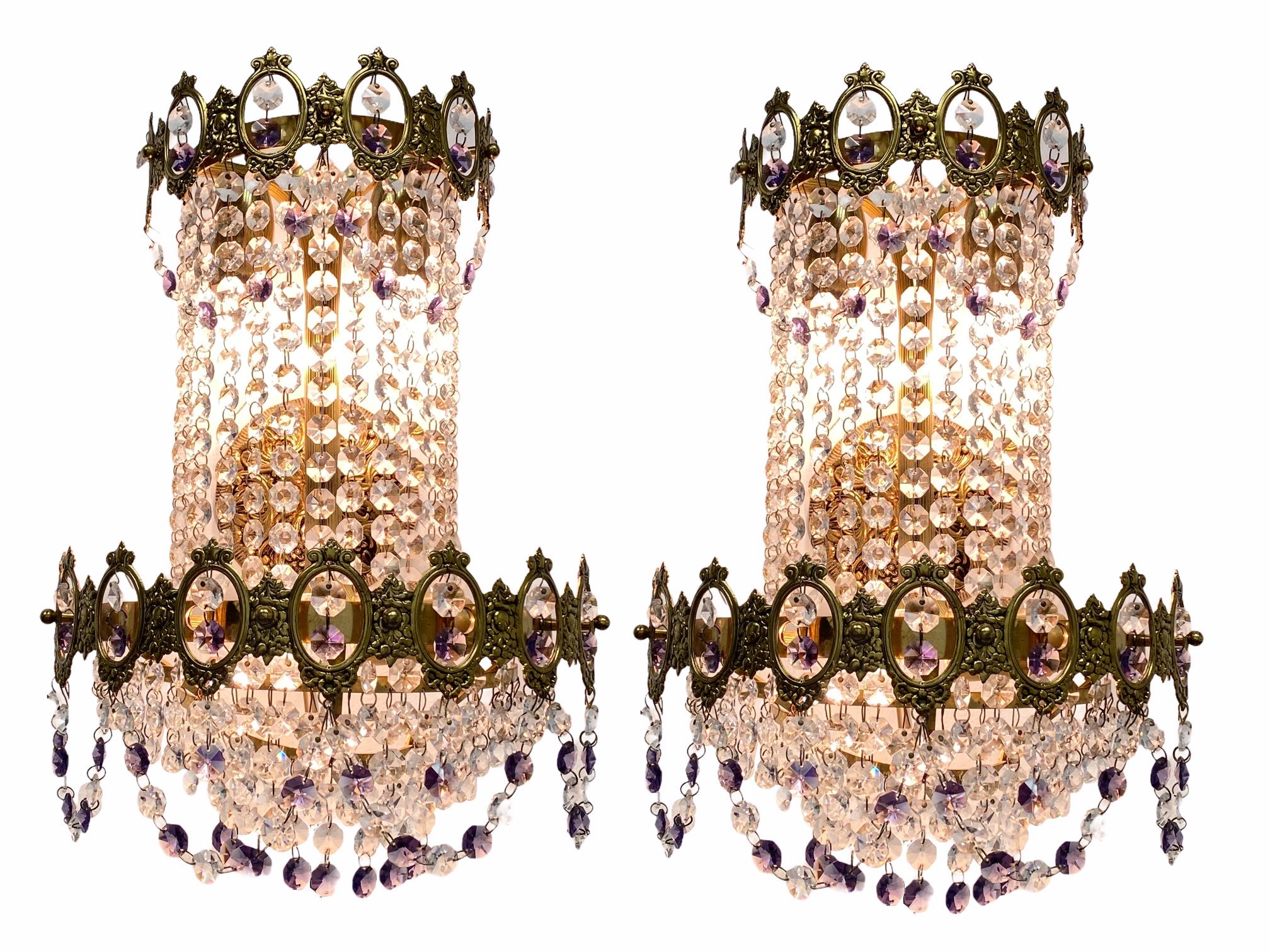 Pair of gilt bronze and crystal 1930s or older, waterfall sconces in empire style. Each fixture requires three European E14 candelabra bulbs, each bulb up to 40 watts. The wall lights have a beautiful patina and gives each room an eclectic