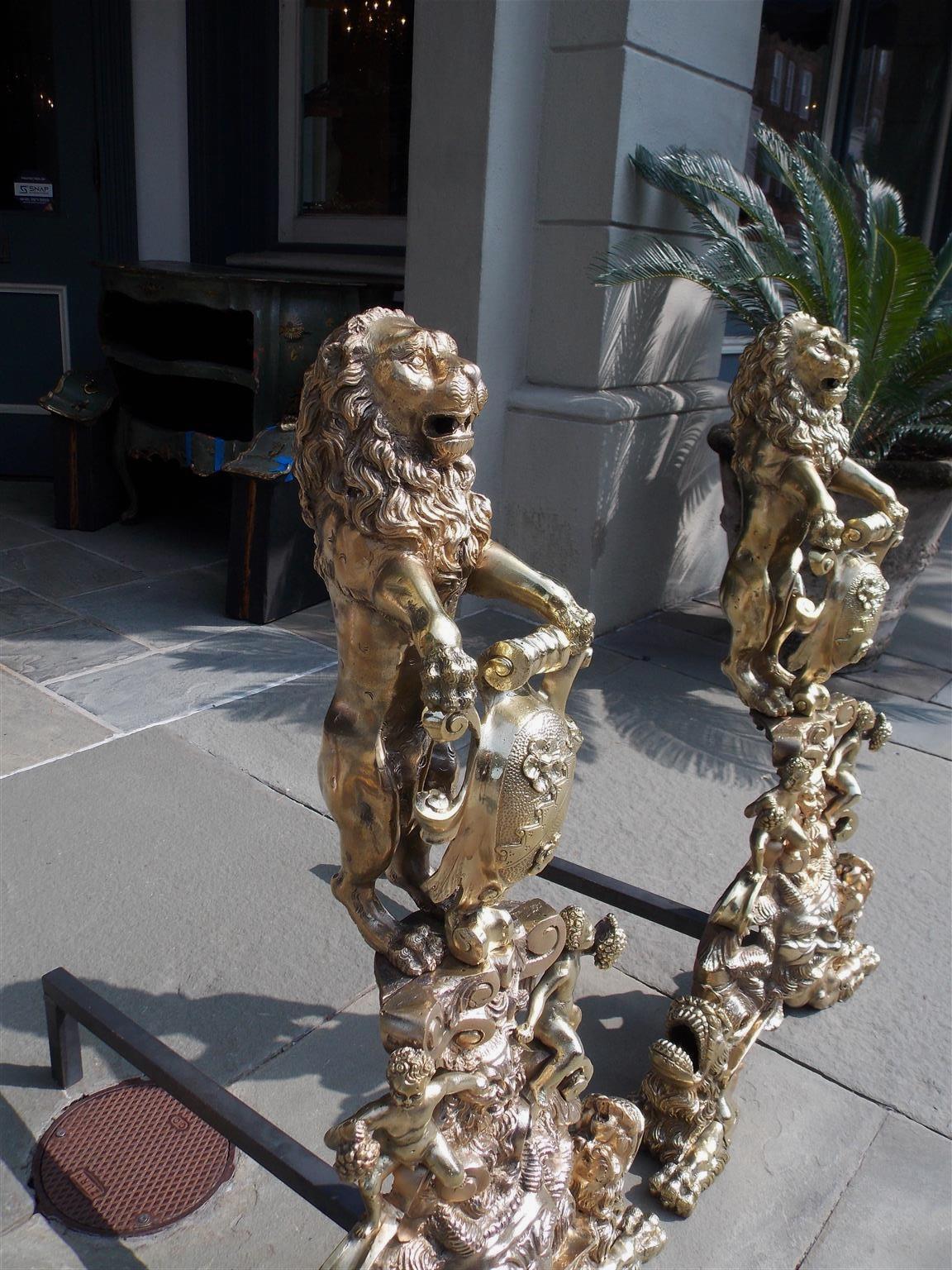 Cast Pair of Monumental English Brass Medallion Lion Andirons with Paw Feet, C. 1820