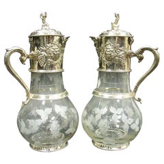 Pair of Monumental English Sliver Plated and Engraved Glass Claret Jugs