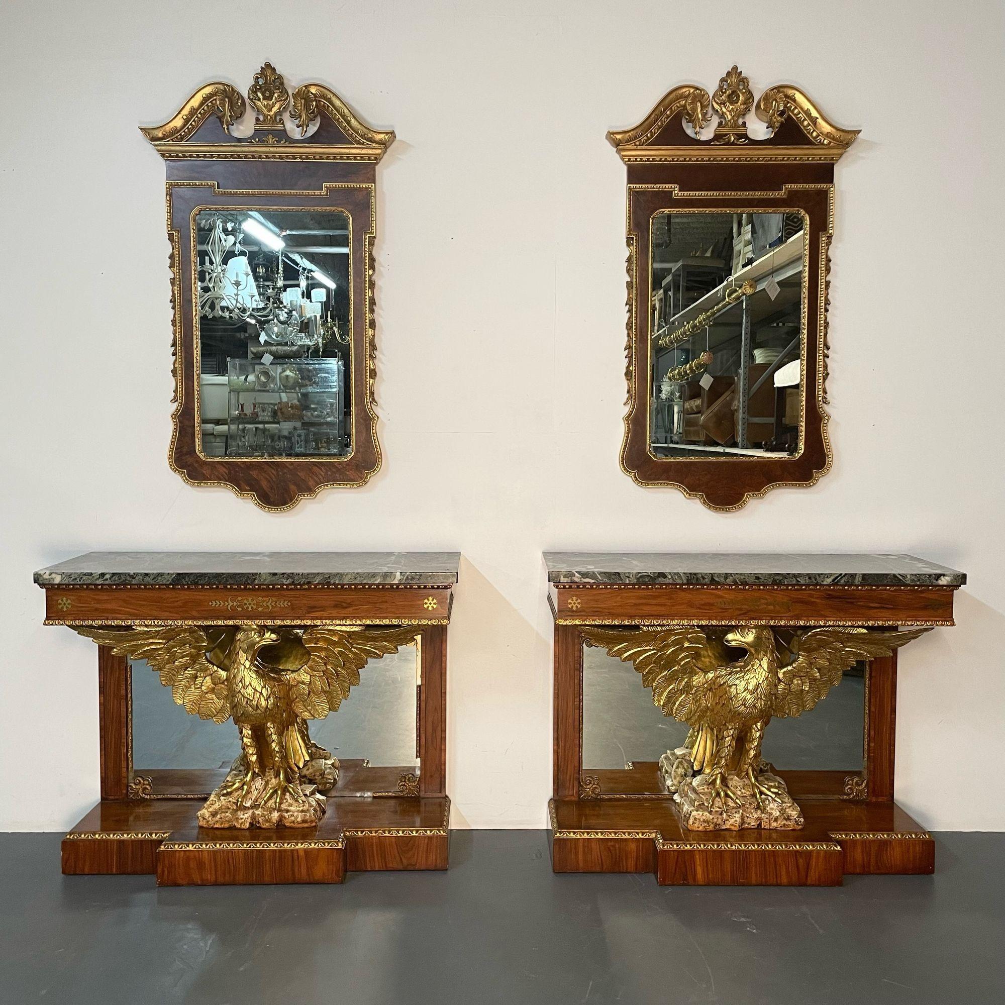 A fine pair of monumental Federal style console tables each having boule inlays and carved opposing eagles wings spread sitting on a rock base. The bracket base with a gilt carved border top having a mirrored back with a marble top supported by a