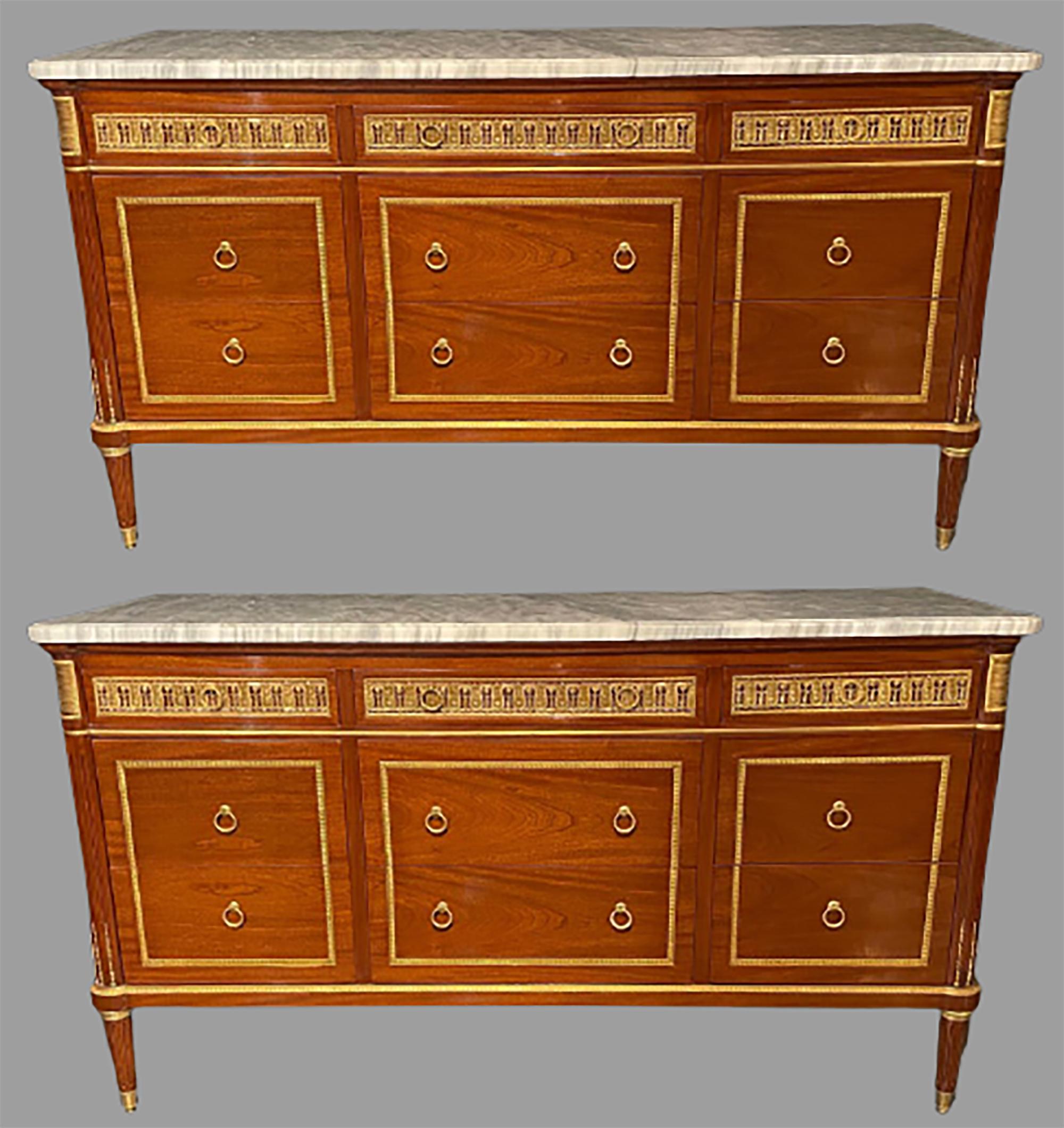 Pair of monumental Louis XVI style marble-top commodes in the Maison Jansen fashion. These impressive and finely constructed commodes or sideboards are simply stunning and leave nothing to the imagination. Palatial, 39 inches high and 69.25 inches
