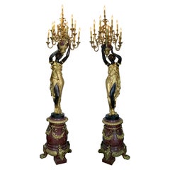 Paire de torchères monumentales françaises en bronze doré et patiné et marbre rouge