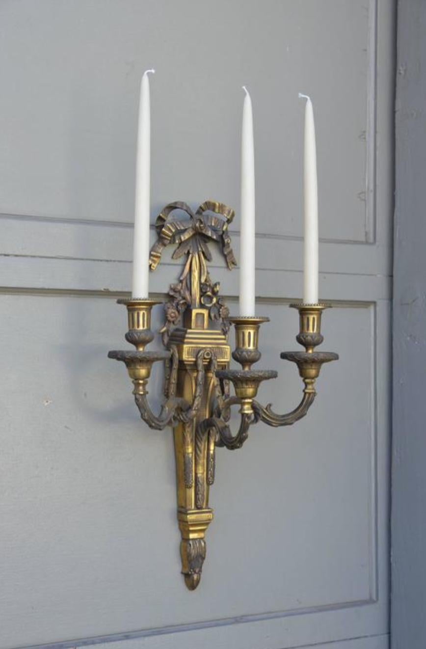 Pair of Monumental Gilt Bronze Louis XVI Style sconces.