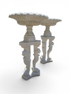 Pair of Monumental Greco-Roman Marble Kraters on Tripod Pedestals with Lion Paw