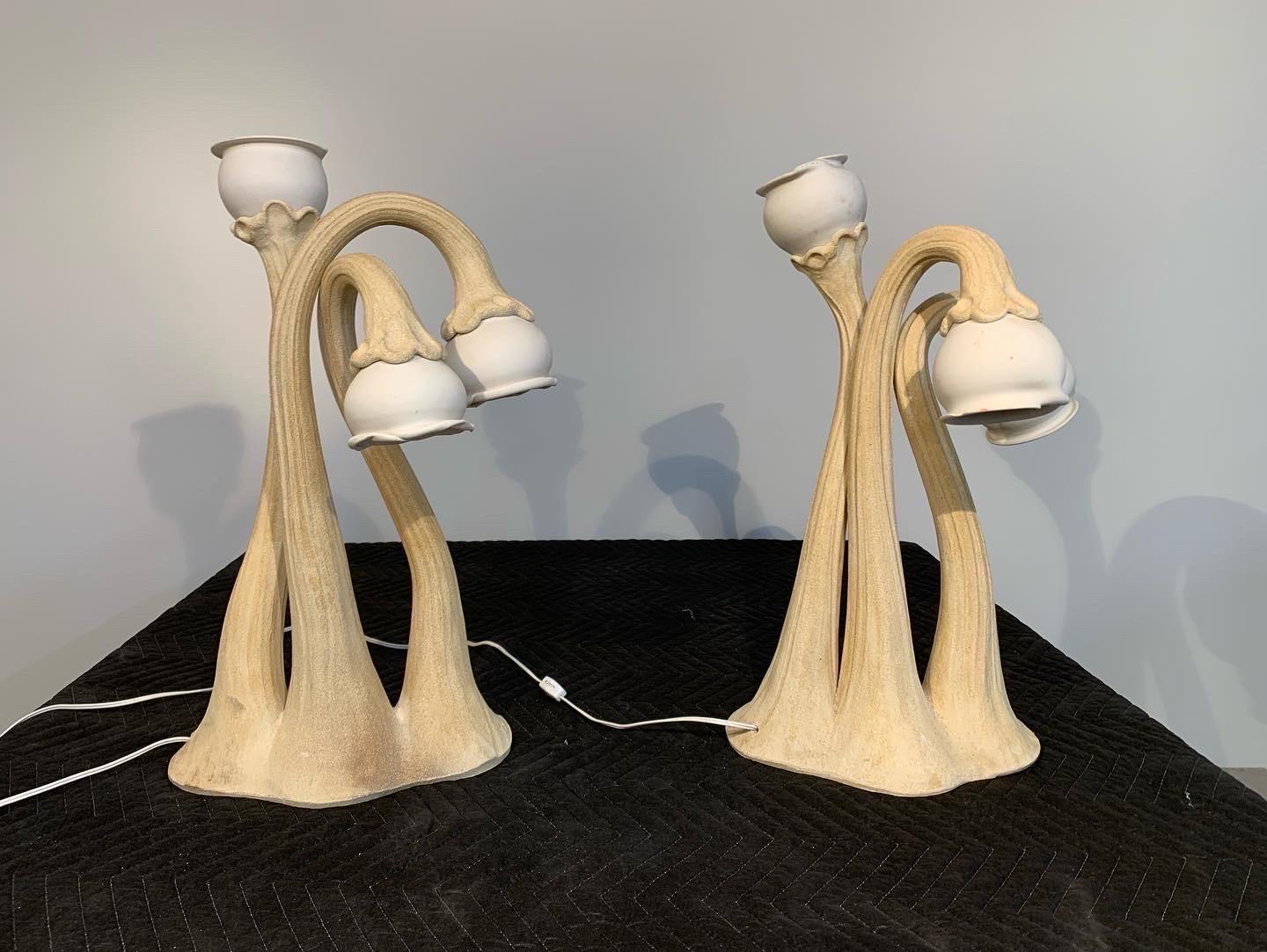 A rare pair of 3-stem handmade ceramic Calla Lilly lamps by Doug Blum 
Circa 1980 Each Standing 32” Tall
Very nice overall condition having 2 tiny chips as pointed out in the images provided. 
These will be hand delivered into your home after