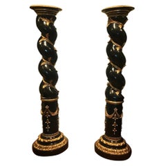 Pair of Monumental Italian Ebonized and Parcel-Gilt Columns