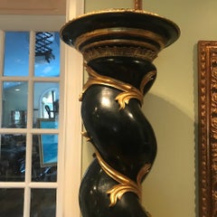 Pair of Monumental Italian Ebonized and Parcel-Gilt Columns