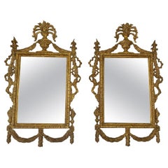 Paire de miroirs monumentaux de style italien en bois doré des années 1930