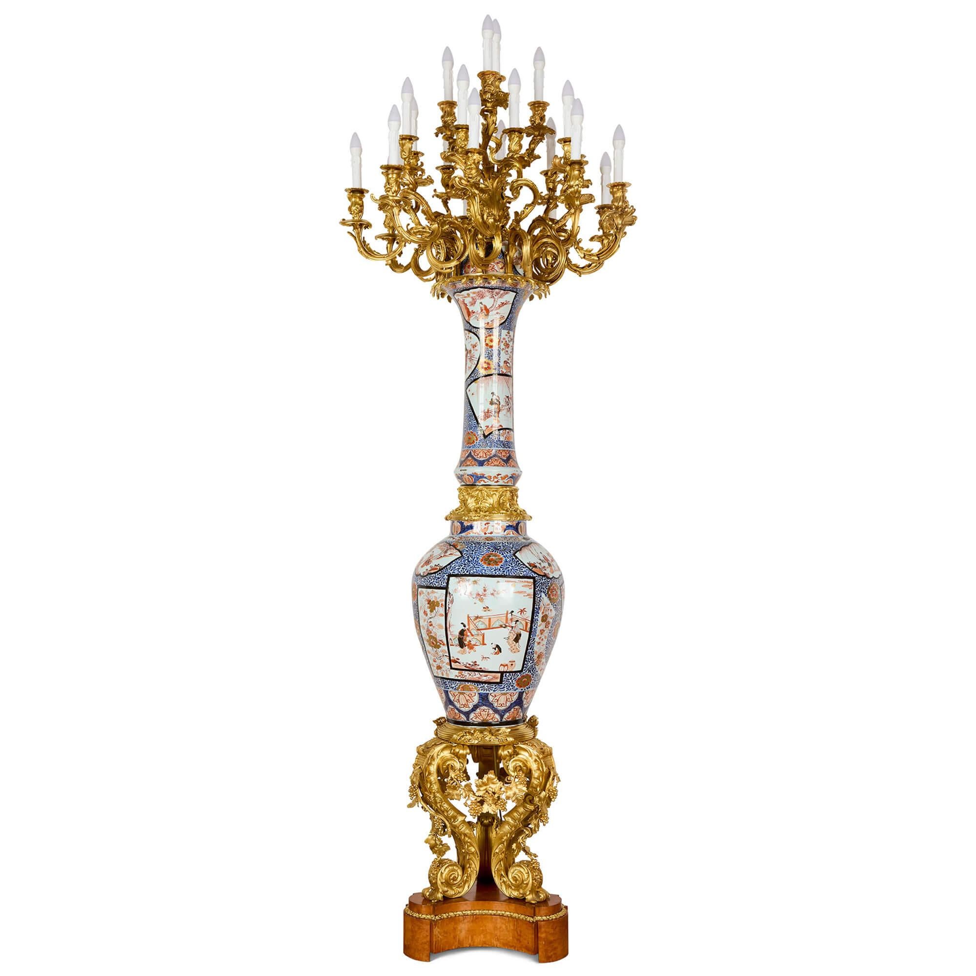 Pair of Monumental Large Japanese French Imari Porcelain Ormolu Candelabra
Porcelain: Japanese, 18th Century 
Ormolu: French, Mid-19th Century 
Height 260cm, diameter 86cm

This exceptional pair of antique candelabra showcases a remarkable marriage
