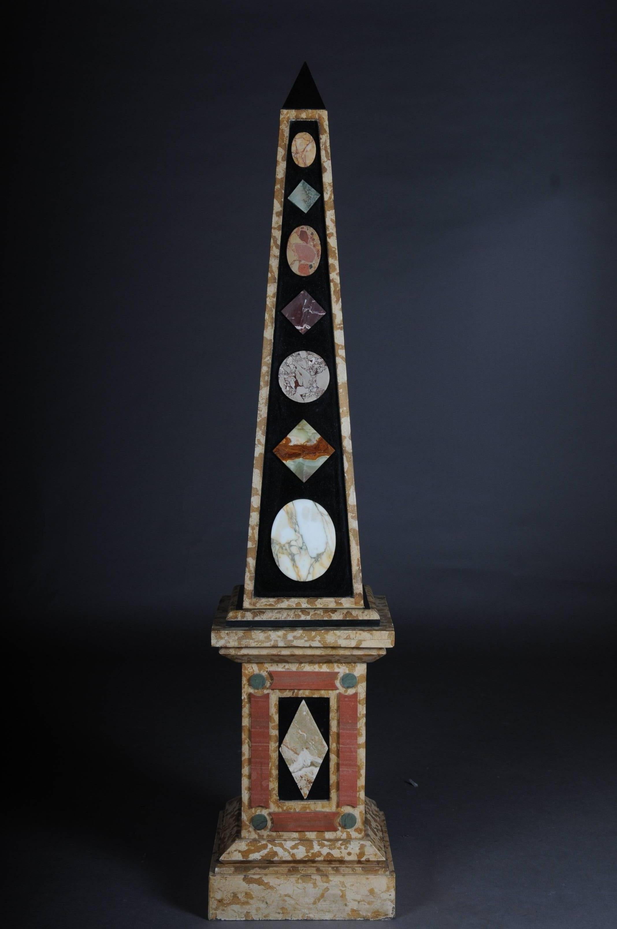 Extremely rare and decorative obelisk pair. Various types of marble an absolute rarity and a guaranteed eye-catcher in every interior. Measures: 73.2 inch. 


(U-Hud-2).