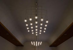 Pair of Monumental Mid Century Chandeliers in Glass, Metal and Patinated Brass