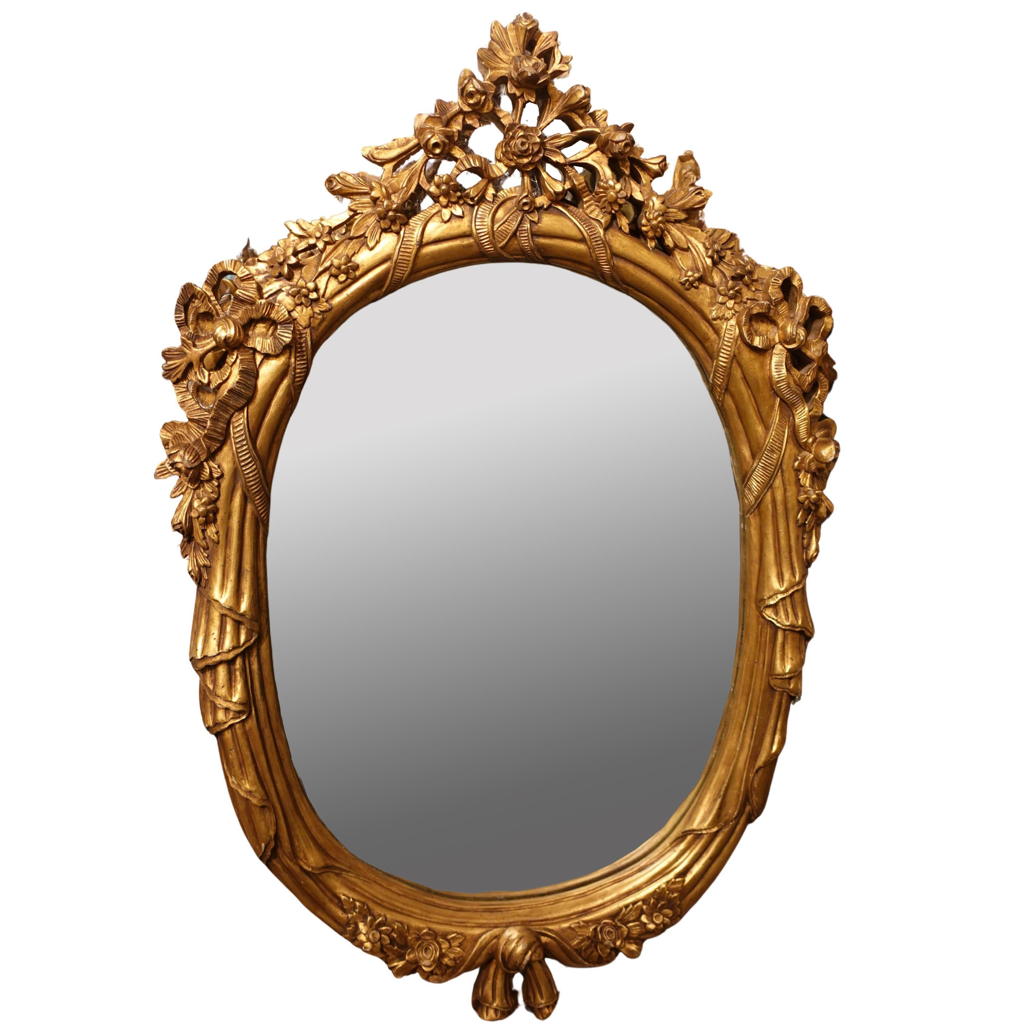 Pair of Monumental Oval Louis XV Style Mirrors

Approximate size:  50.75”H x 34.5”W x 3.5”D each

Giltwood; probably 19th century

This pair of large oval giltwood Louis XV style mirrors immediately command attention, exuding an air of classical