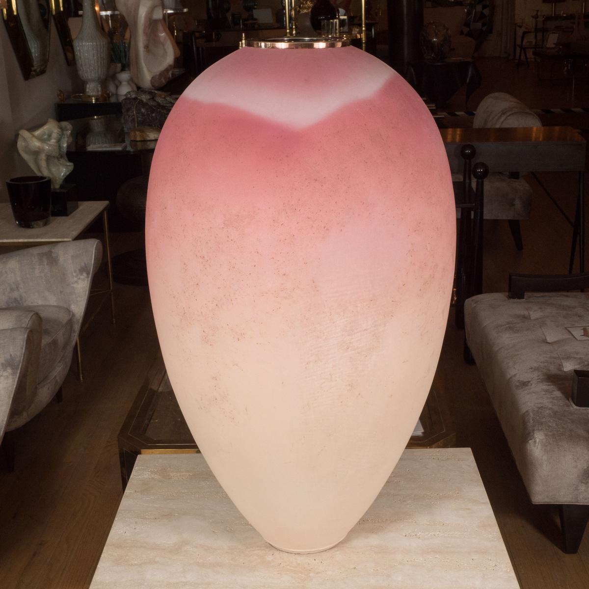 Pair of monumental ombre pink pottery vases with metal trim.