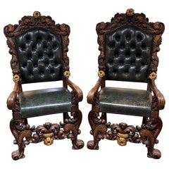 Coppia di Fauteuil monumentali in stile rinascimentale in noce intagliato e dorato