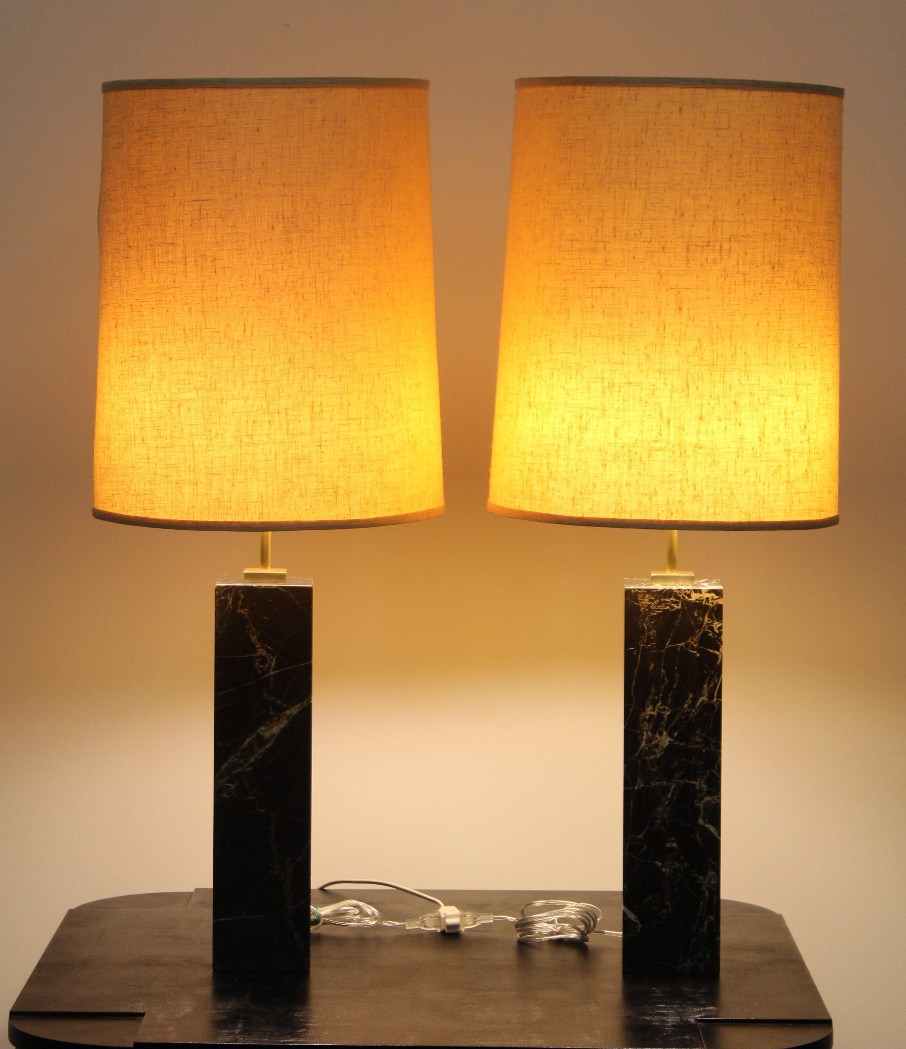Pair of monumental Robsjohn Gibbings style black marble lamps, 1960s. Newly rewired with high quality brass sockets and hardware. Ready to be placed in your home. 

Lamp shades not included.