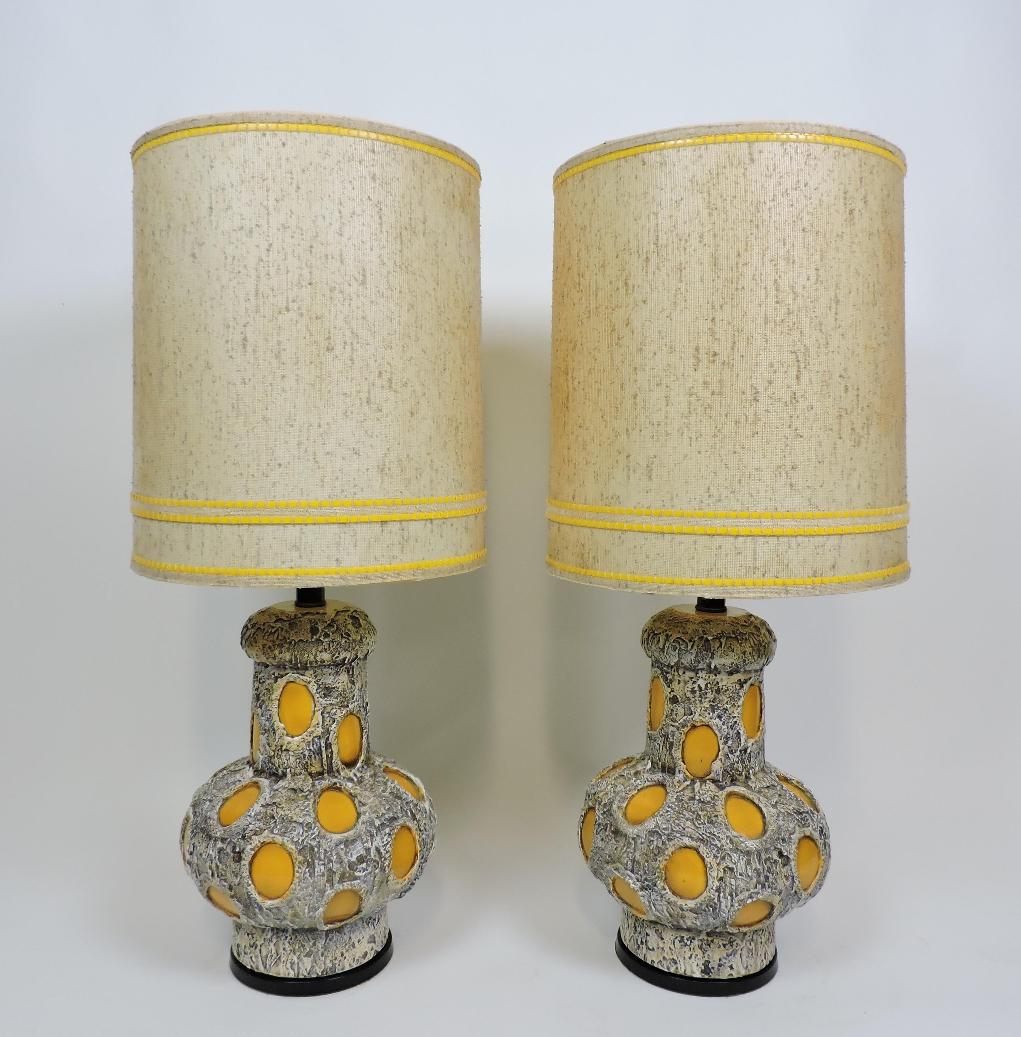 Fun and funky pair of large table lamps from 1975 by Italian designer, Pieri Tullio. These heavy and well-made lamps have a unique textured design and the original shades. Marked on bottom - 75 Pieri.
Just let us know if you would like to have them